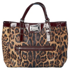 Dolce Gabbana - Manteau enduite léopard imprimé canevas et détails en cuir bordeaux 