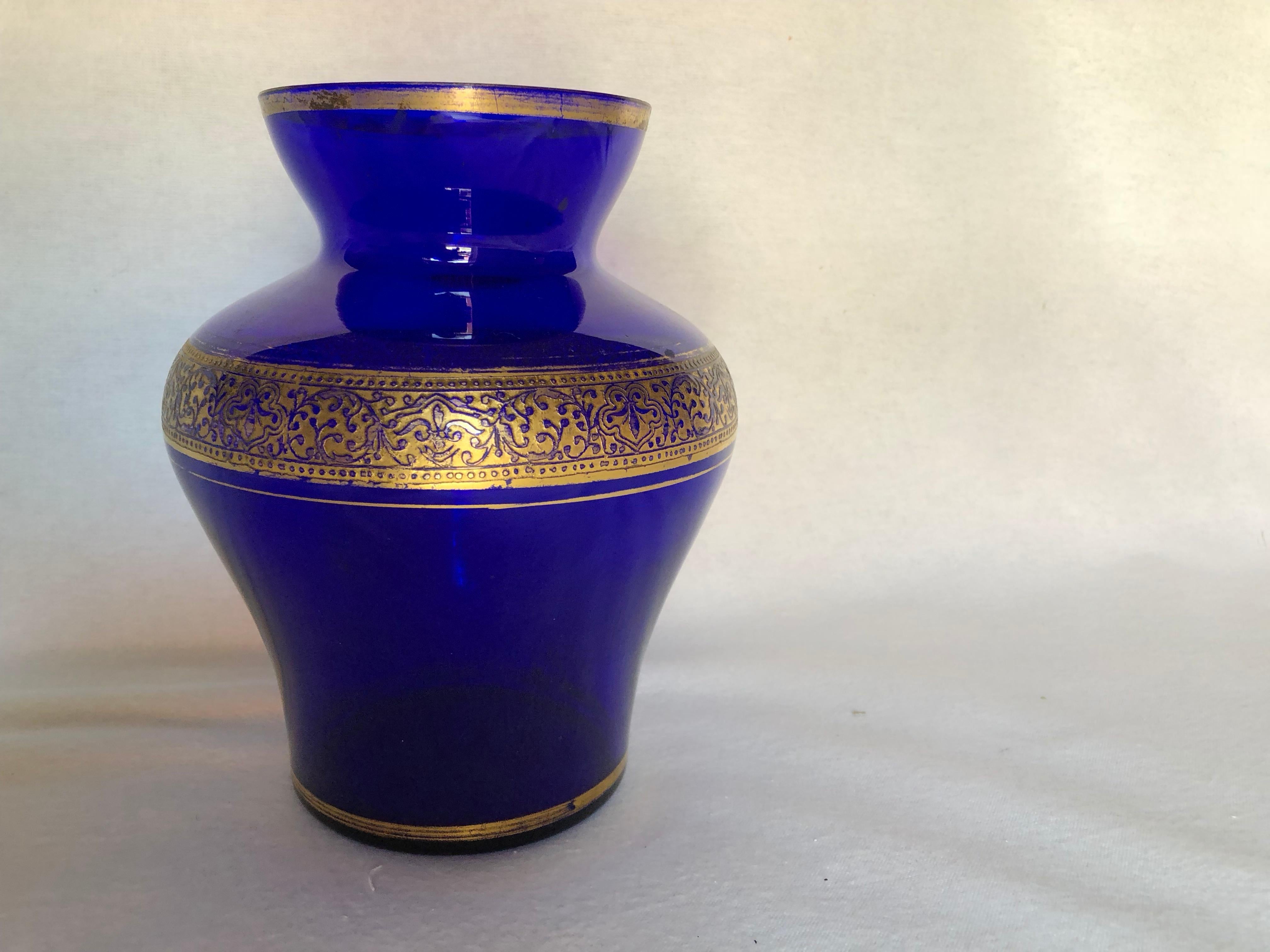 blue glass vase with gold trim