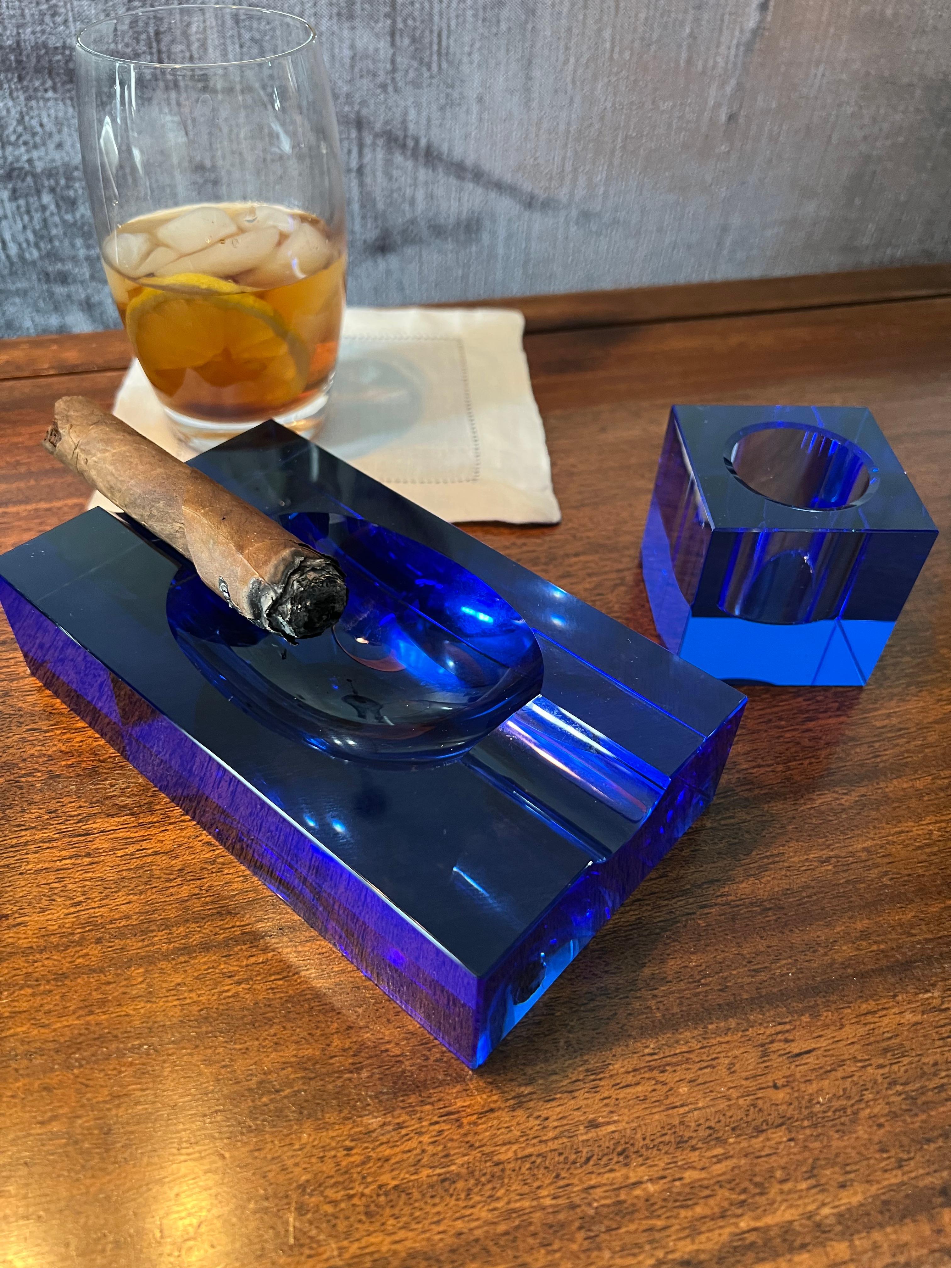 A truly stunning Cobalt blue ash tray perfect for those occasional cigars, 420 or french cigarettes! A compliment to any desk, bar, or smoking room.

The ashtray also comes with a lighter, and while it sparks we cannot seem to get I to light - the