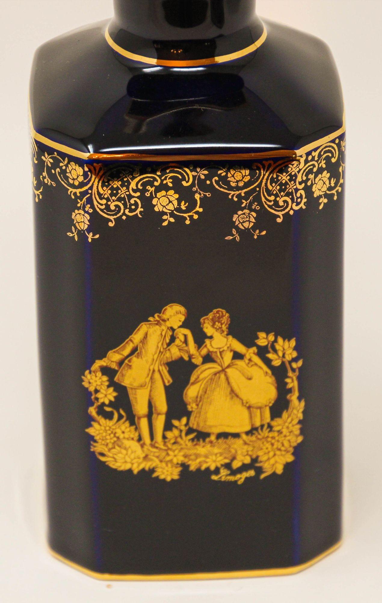Vintage Limoges gilded French cobalt blue porcelain decanter featuring a beautiful scene of lovers courting done in 22kt gold.
There is hand painted gold floral around the top portion.
French vintage Limoges porcelain bottle in cobalt royal blue
