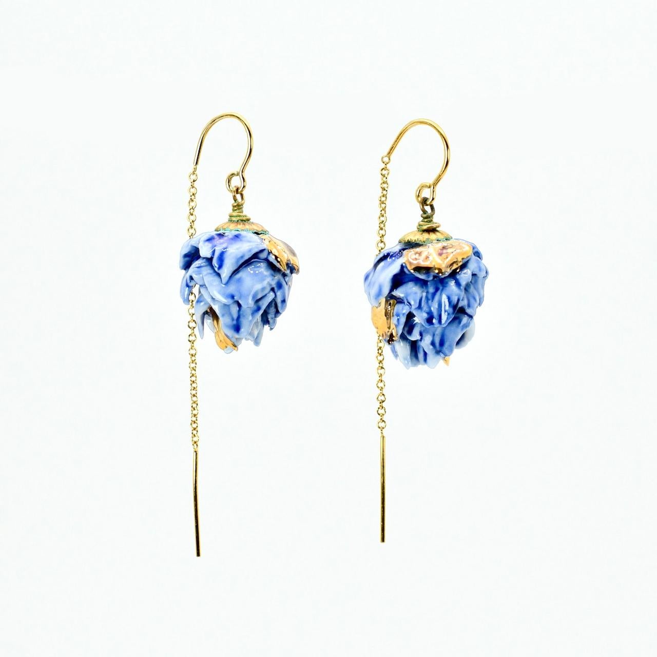 Porcelain  24K gold  Handmade in London

These Cobalt Blue Porcelain Artichokes Earrings are intricately handcrafted with white and blue porcelain and enhanced with hints of blue patina, creating a classy and a bit vintage combination. The