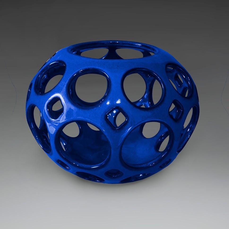 Wheel thrown, hand pierced ceramic tabletop sculpture/ vessel. This piece provides the perfect pop of color to any room. It can stand alone as an art piece, or with a candle, it can illuminate a room or outdoor space creating a light show of playful
