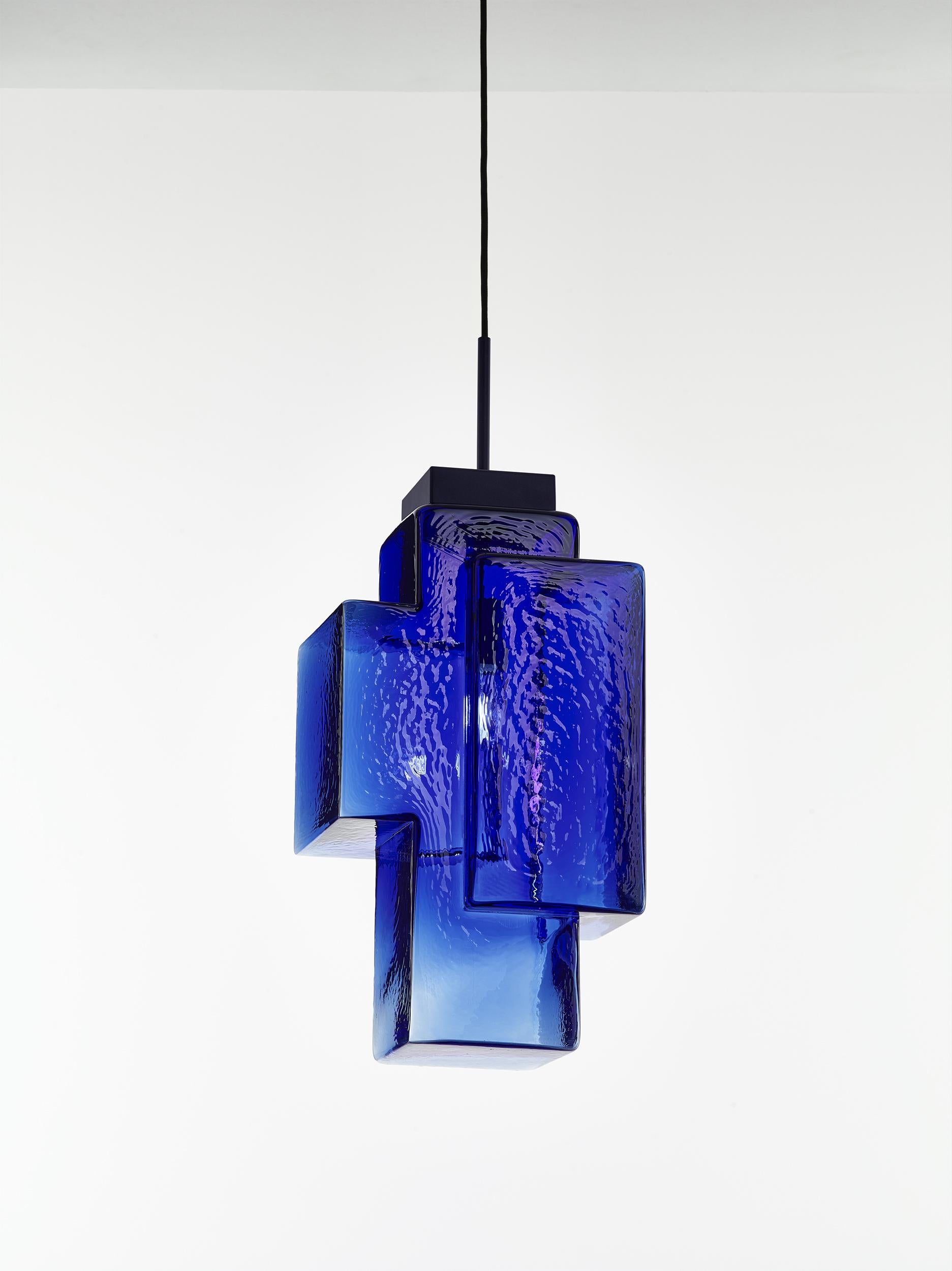Cobalt blue Tetris pendant light by Dechem Studio
Dimensions: W 30 x D 23 x H 200 cm
Materials: metal, glass.
Also available: different colours available.

In this complex lighting fixture, strict geometric and architectural lines contrast with