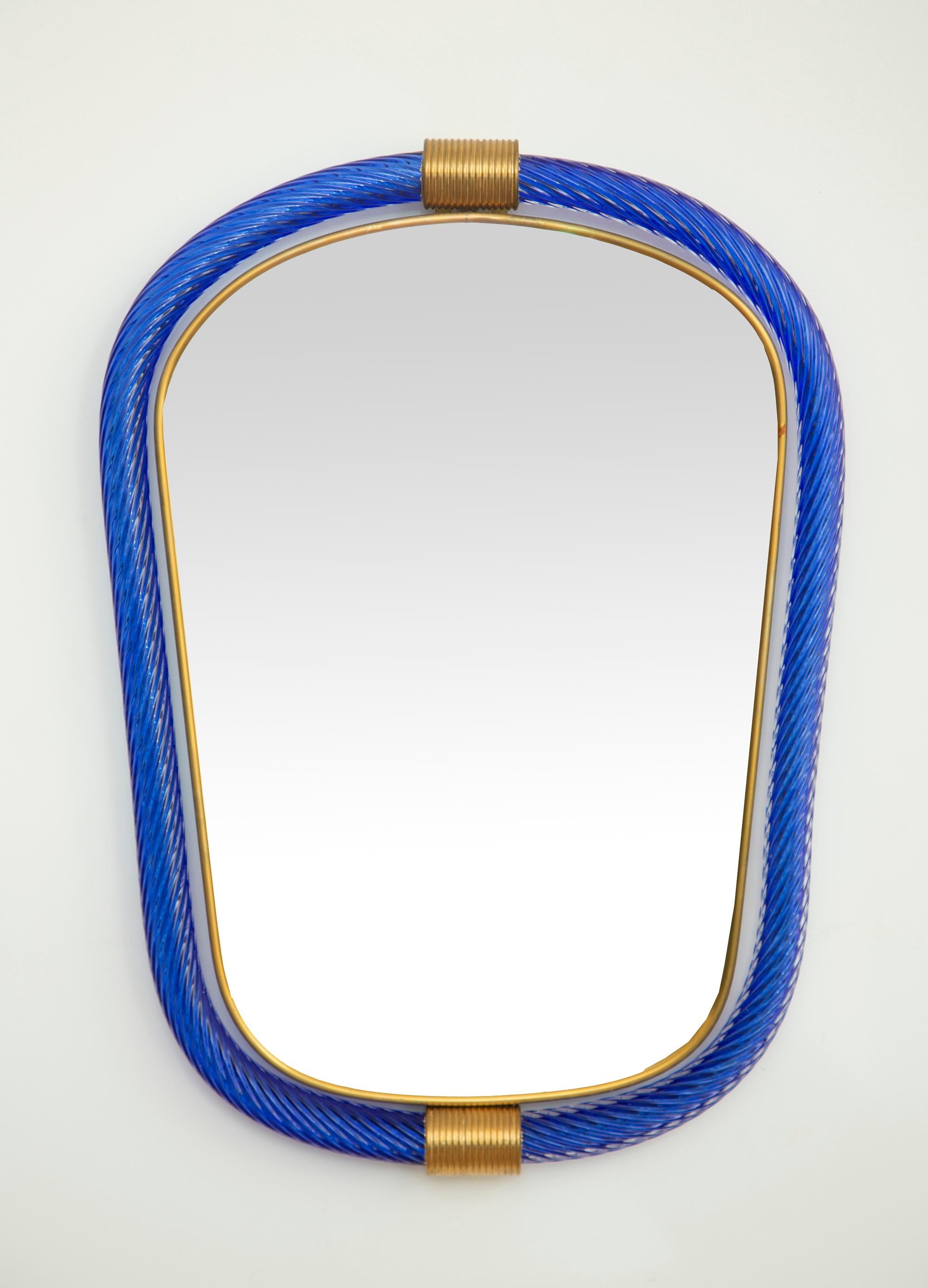 Cobalt blue twisted rope Murano glass mirror, in stock
Two brass accents and a thin inner brass gallery
11