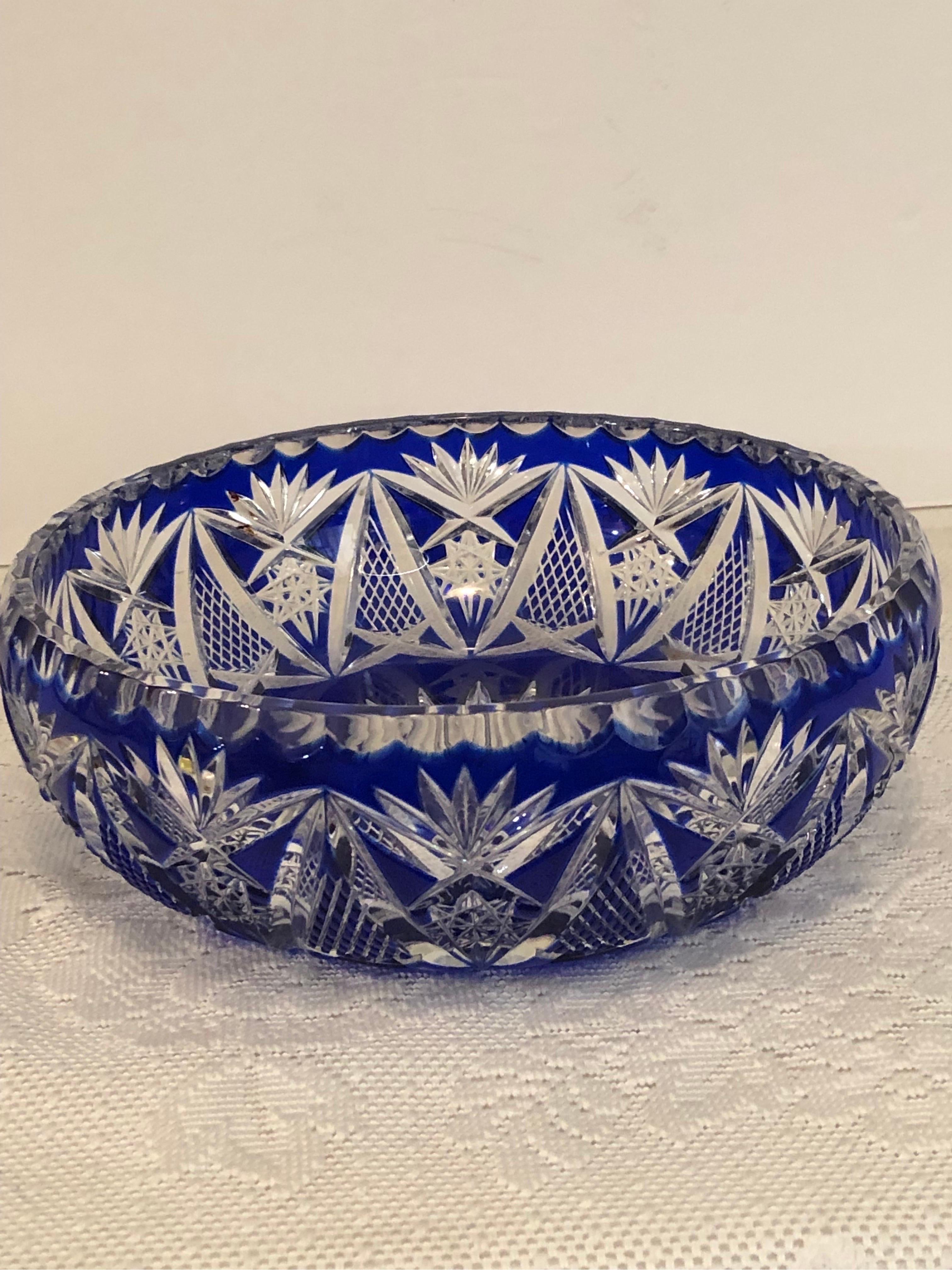 I am offering you this elaborately cut cobalt crystal Bohemian Czechoslovakian bowl. If you like brilliant cut glass, you will love this intricately cut bowl. It is a stunning bowl for you to use on your table. This bowl would also be beautiful in a