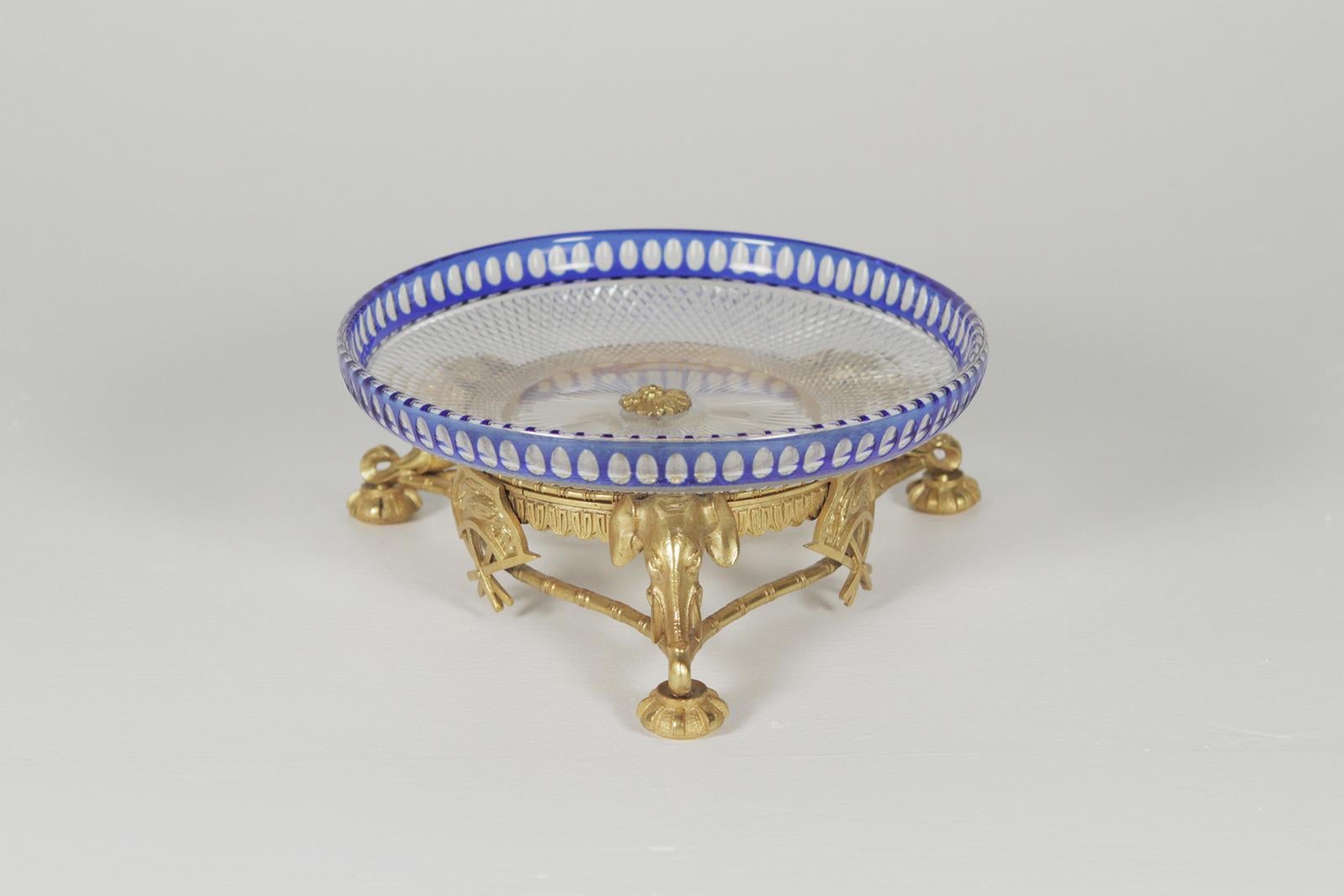 Beautiful crystal bowl on a gold gilt bronze base with elephant motif accents. The hand cut cobalt cut to clear dish attributed to  Val St Lambert, circa 1900.
