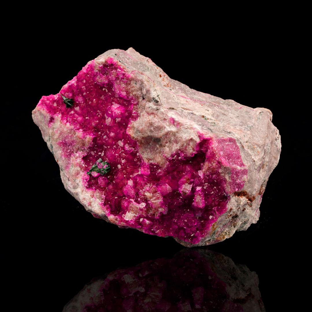 This thick coating of rare Cobaltoan calcite on host rock is beautifully crystallized with relatively large crystals, incredible natural sparkle and luster, and truly the best bright magenta pigmentation we have seen in this species to date. Both
