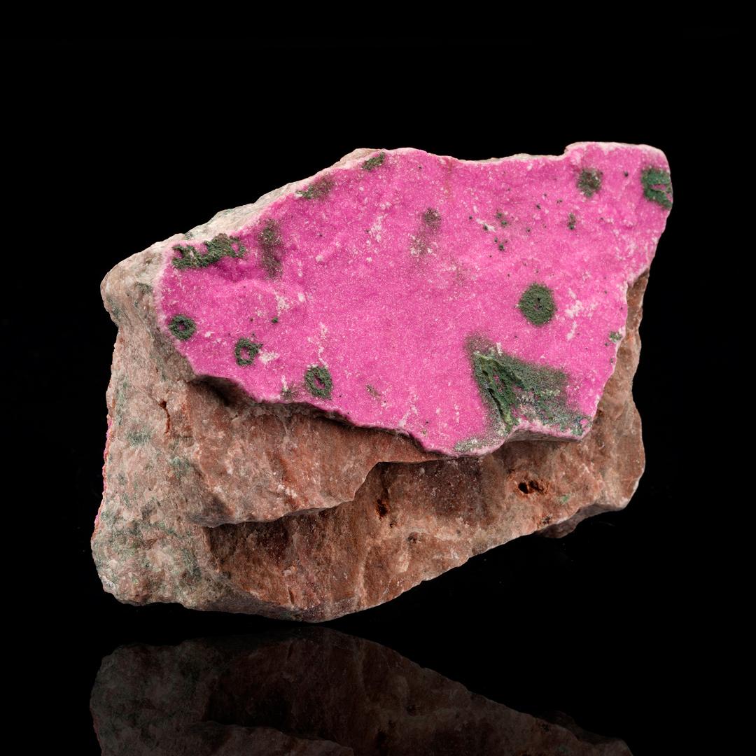 This coating of Cobaltoan calcite on host rock brings beautiful natural sparkle and luster and some of the best bright magenta pigmentation we have seen in this species to date. Both sides of the host rock are coated in the mineral. Cobaltoan