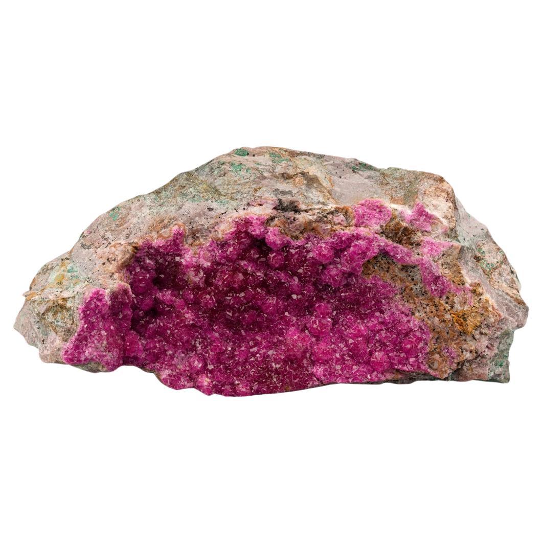 This thick coating of Cobaltoan calcite on host rock brings beautiful natural sparkle and luster and some of the best bright magenta pigmentation we have seen in this species to date complete with moderately sized crystallization. Cobaltoan calcite