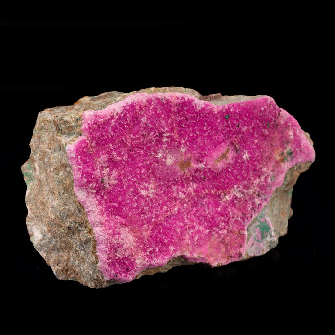 This thick coating of rare Cobaltoan calcite on host rock is beautifully crystallized with incredible natural sparkle and luster and truly the best hot pink color we have seen in this species to date. Cobaltoan calcite results from cobalt ions