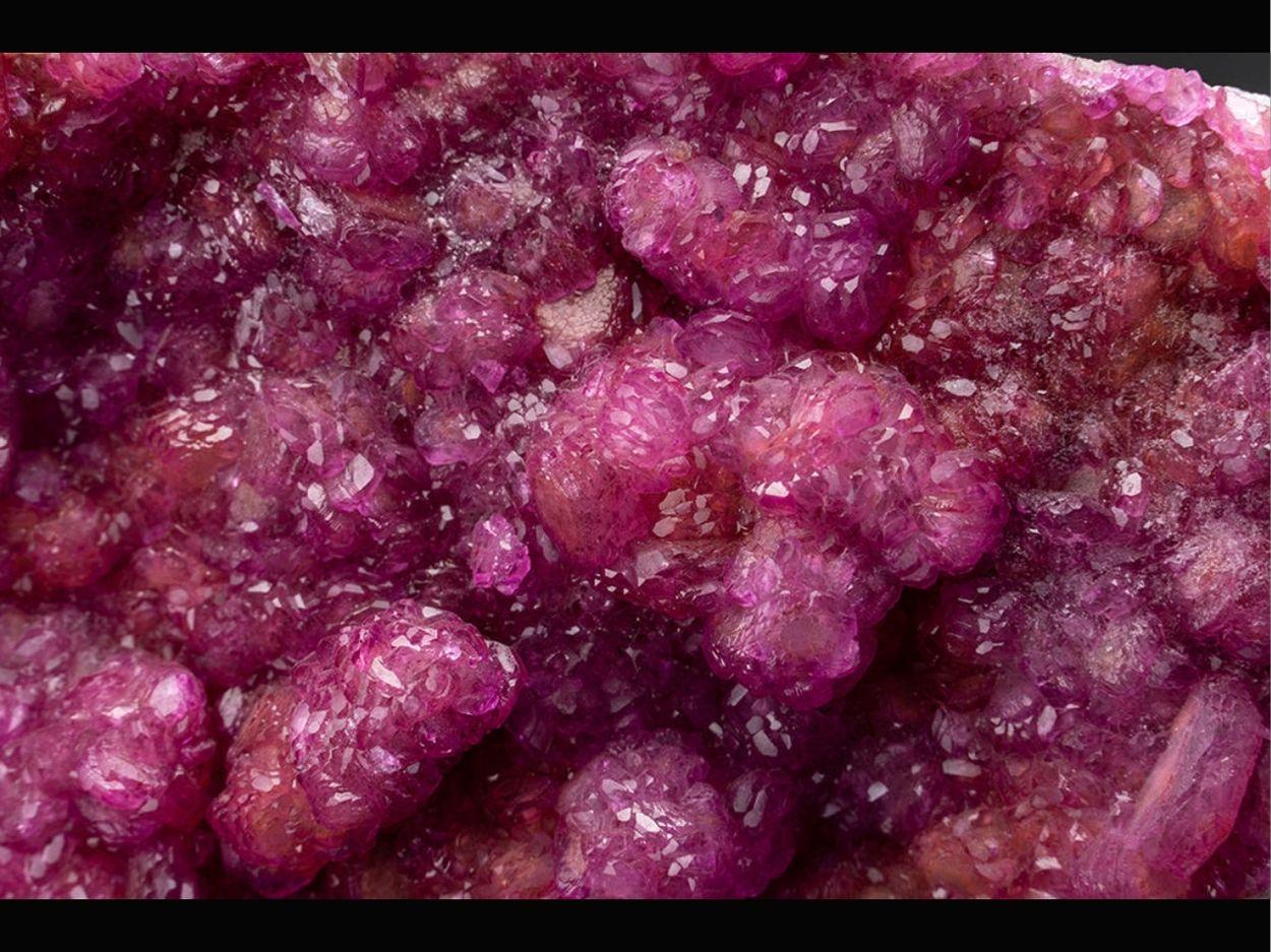 From Mashamba West , Kolwezi, Western area, Shaba Cu belt, Shaba (Katanga), Congo (Zaire)

Complex cluster of lustrous pink translucent flattened rhombohedral cobalt-rich Calcite crystals on matrix. Has bright intense color with scintillating