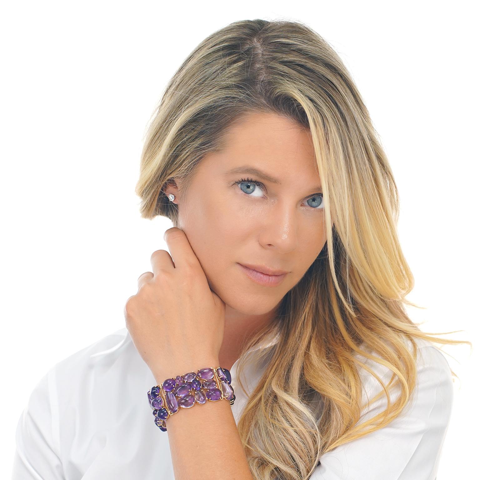 Circa 1970s, 14k, American. This bracelet is a lush brushstroke of vivid purple amethyst cabochons. 250 carats of stones flowing from lavender to lilac and violet are perfectly puzzled together in a cobblestone motif. The vibrant, easy-breezy look