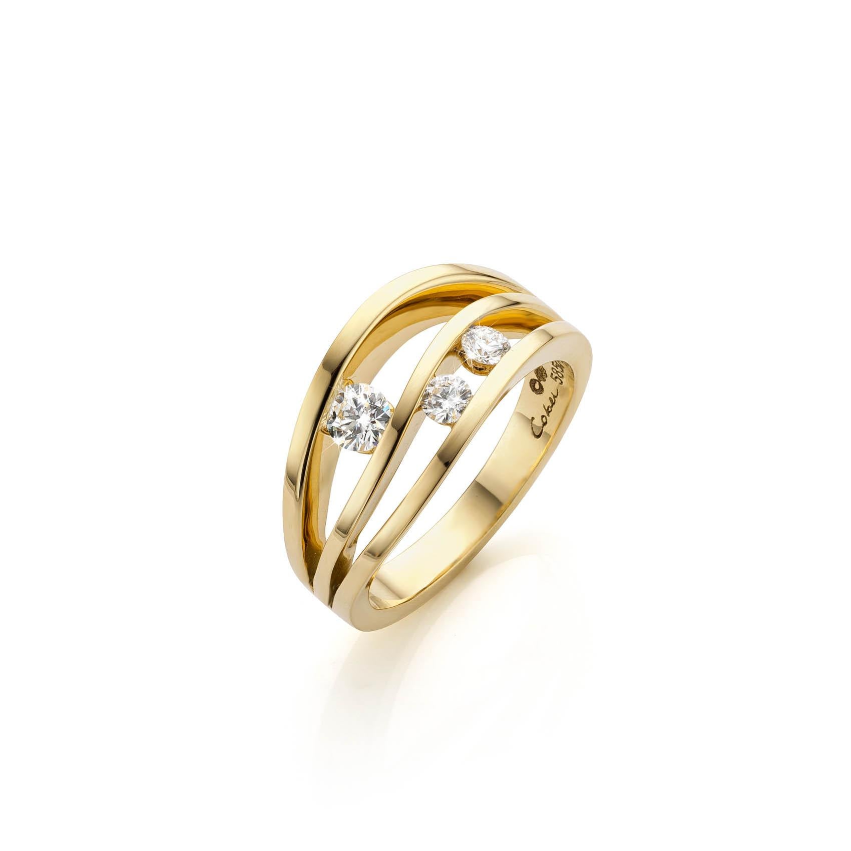 This is a 14 Carat Yellow gold ring with 3 Brilliant-cut Diamonds. This ring is available in different design. We have also one design in White gold.
Cober designs exclusive wedding rings, jewels and watches, all of them made by hand.
“The most