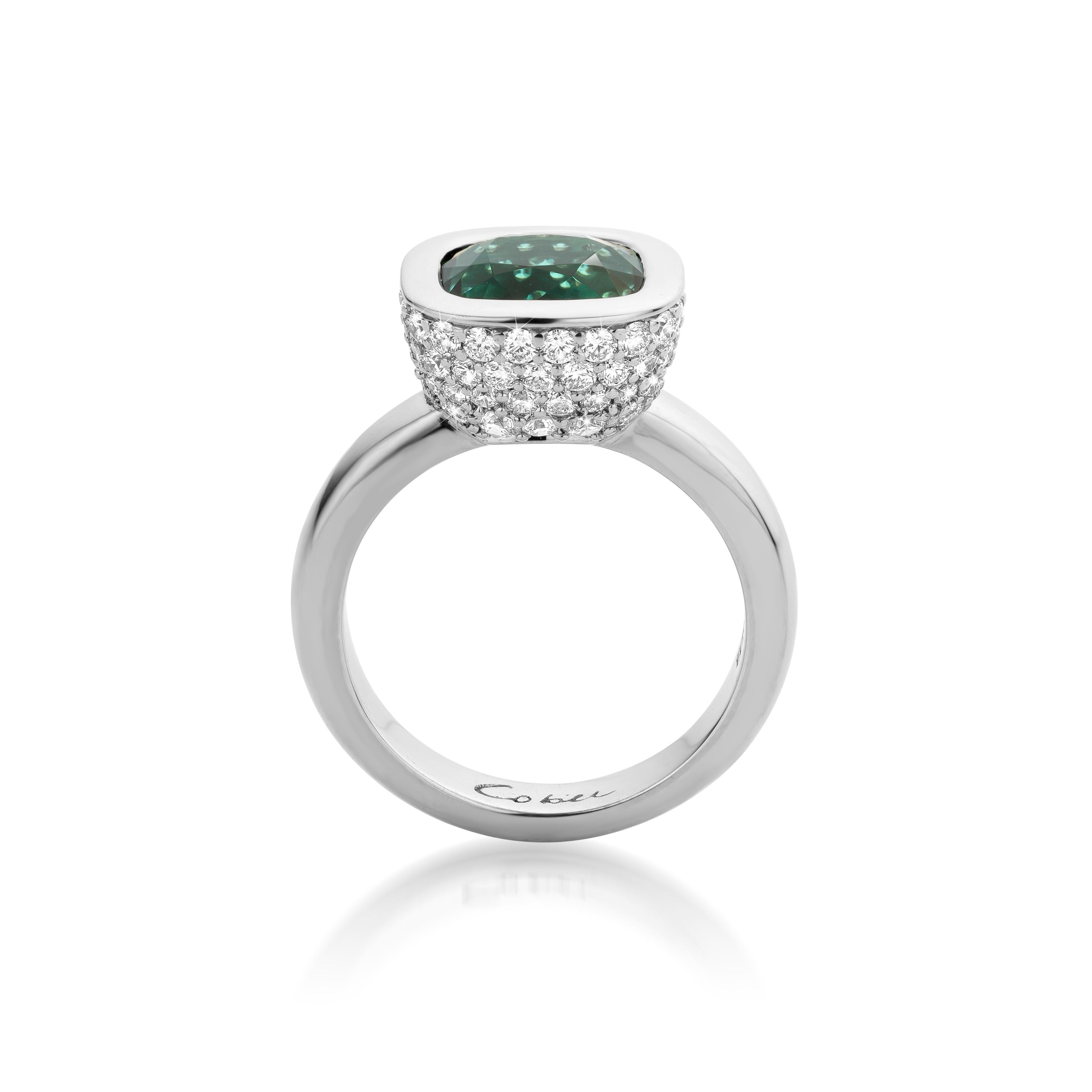 This is a 18 Carat white gold ring with very clear and vivid green Tourmaline. the cup in which the Tourmaline is set has full pavé Diamonds.
Cober designs exclusive wedding rings, jewels and watches, all of them made by hand.
“The most distinctive