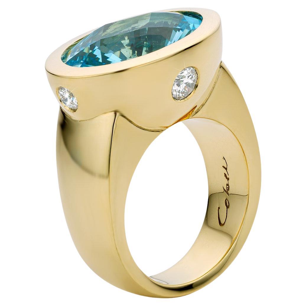 Cober with oval cut with Topaz and 2 x 0.09 Carat 2 x 0.18 Carat Diamonds Ring