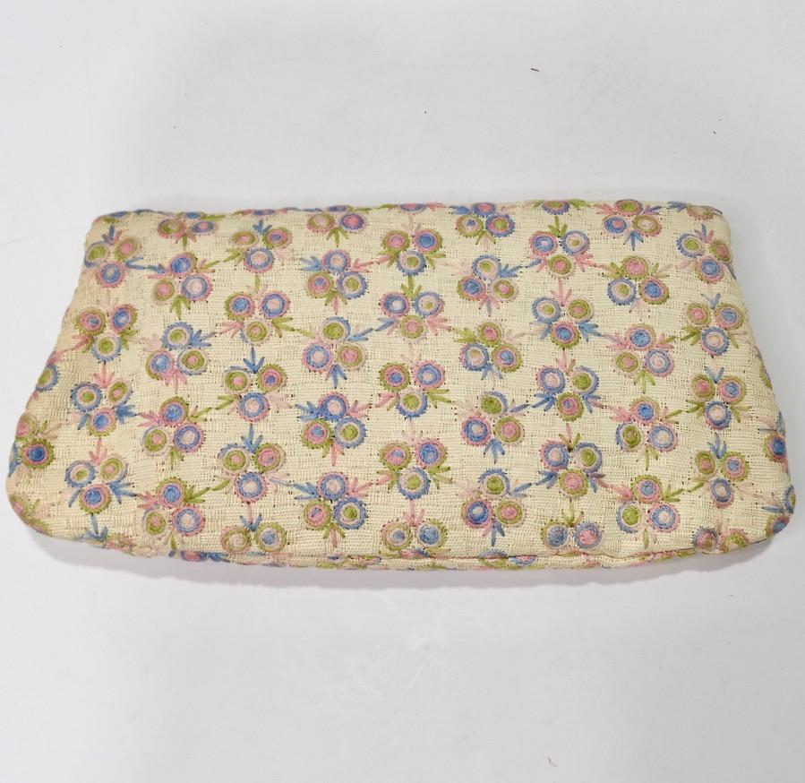 This 1960's Coblentz clutch is so timeless and elegant! Get your hands on this beautiful fold over style clutch that is soo reminiscent of the playful sophistication of the 1960s! Woven off-white clutch features a beautiful palette of pastel pink,