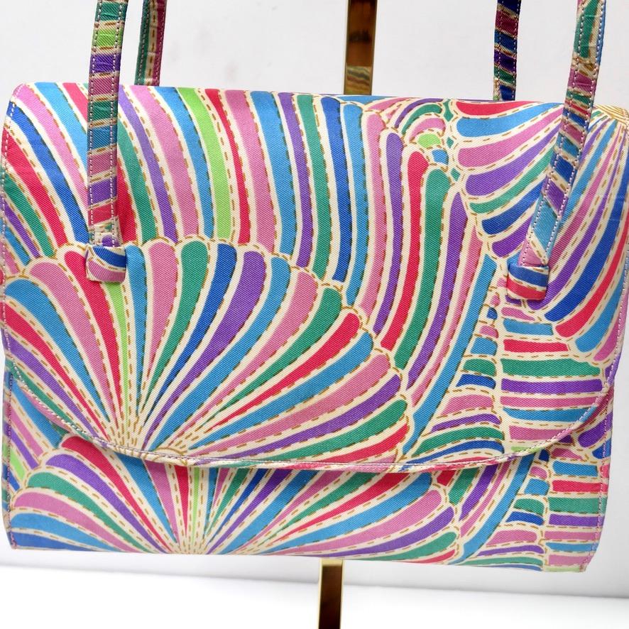 Super fun vintage Coblentz for Saks Fifth Avenue mini handbag circa 1960s! Fold over style handbag with two top handles and a magnetic closure in a vibrant abstract print that draws in the eye. Beautiful shades of pink, purple, green and blue come