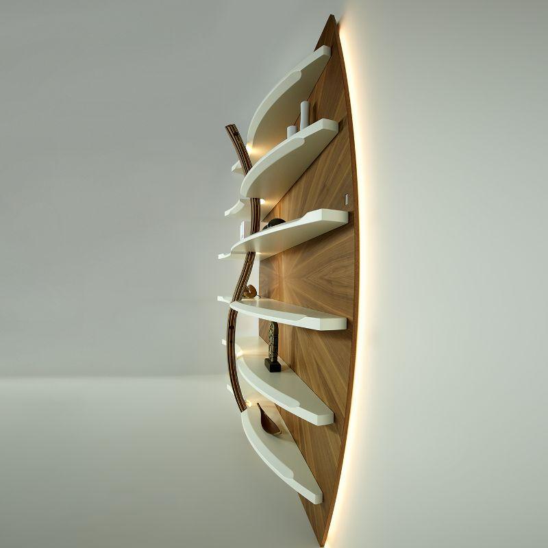 This design bookcase encapsulates its artistic value and presents the Cobra, a sculpture made by hand by combining different sculptural and decorative techniques. The internal structure is in stratified wood which is glued, shaped, and sculpted,
