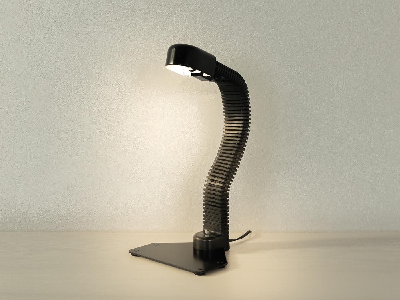 
Article Details
Elegant COBRA desk lamp by Kisho Kurokawa for Yamagiwa from the 1970s. Black lacquered metal base with a flexible, plastic-coated lamp arm and a lampshade made of black metal. The electrical system of the lamp has been completely