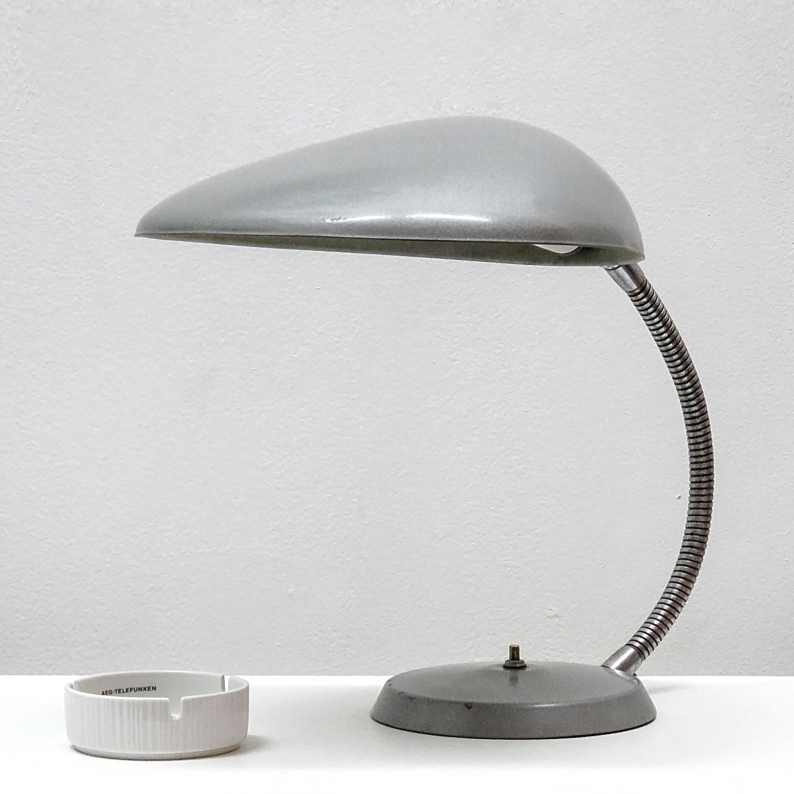 Iconic cobra lamp by Greta M. Grossman for Ralph O. Smith, circa 1950 in grey gun metal finish. Flexible arm, on/off switch at the base. One E26 socket, max. wattage 75w, wired for US standards, bulb provided as a onetime courtesy.