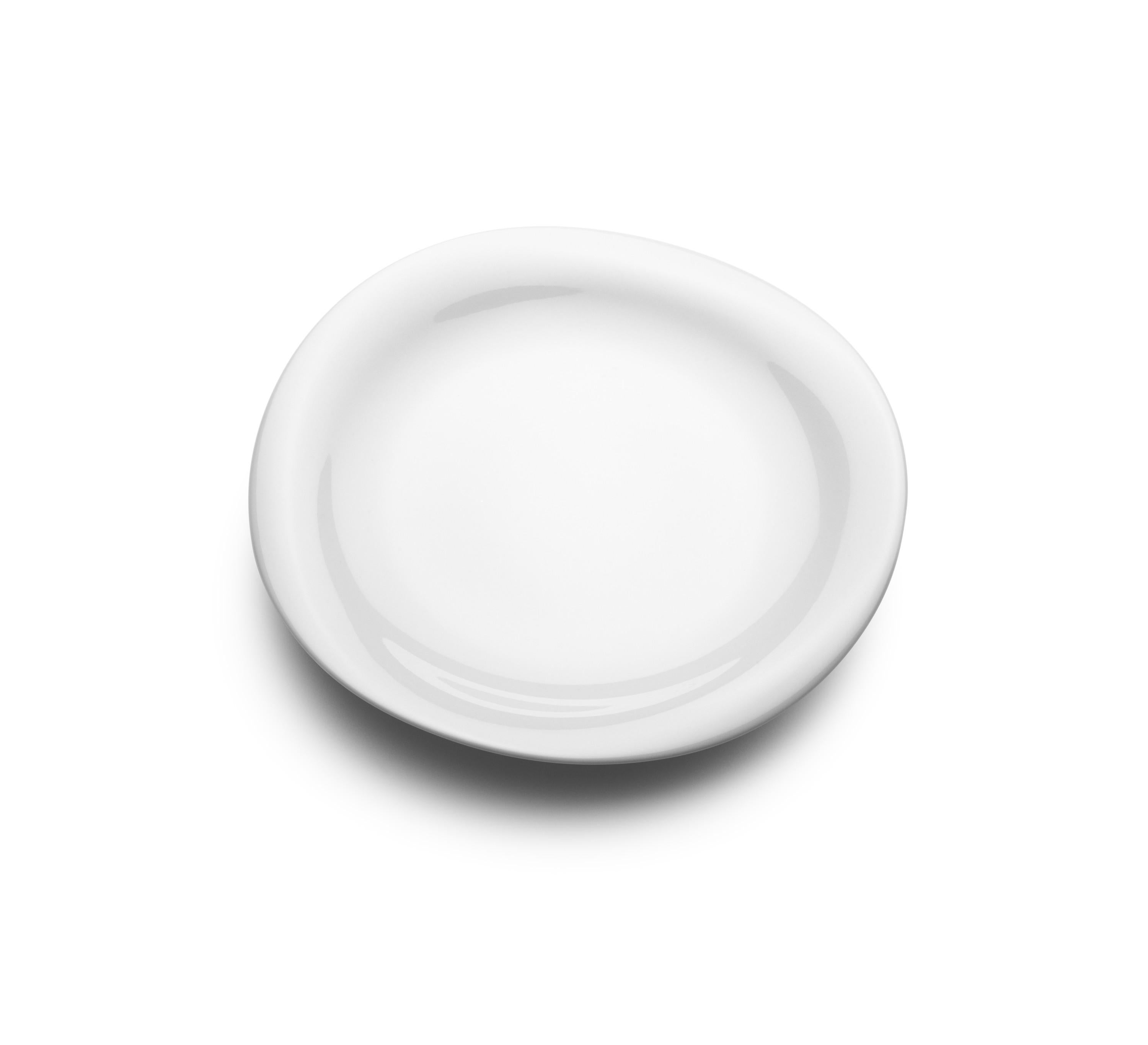 The fluidity of the organic, uneven shape of this plate contrasts beautifully with the clean crisp porcelain, glazed in pure white. Medium in size, the plate is perfect for lunches or appetizer courses and can be part of a larger service comprising