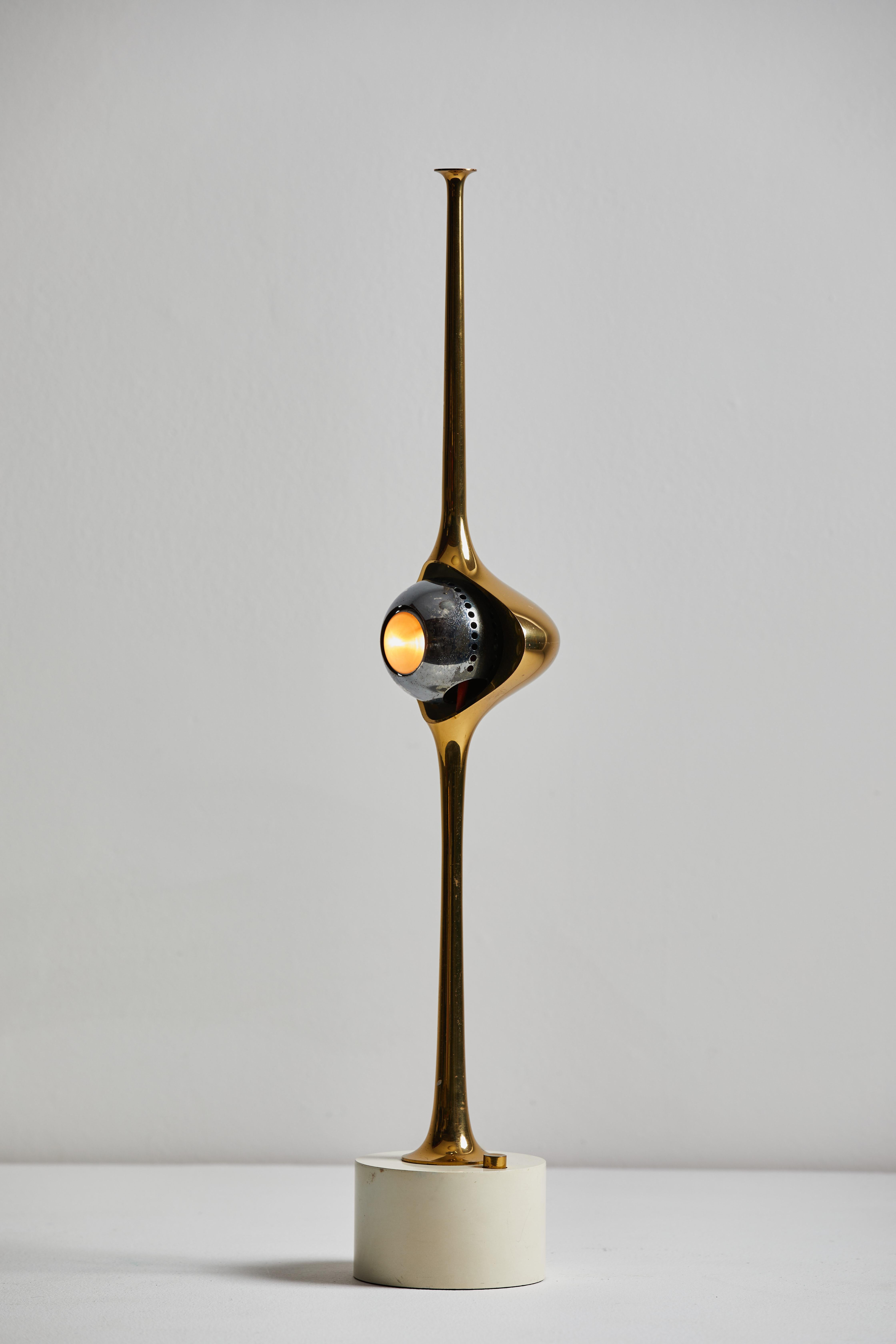 Cobra table lamp by Angelo Lelli for Arredoluce. Designed and manufactured in Italy, circa 1960s. Brass shade, encasing a magnetic, steel eyeball. Original cord. Takes one E27 European candelabra bulb. Bulb provided as a one time courtesy.