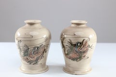 Cobridge Stoneware. signed by Eric Knowles. Two small fish vases
