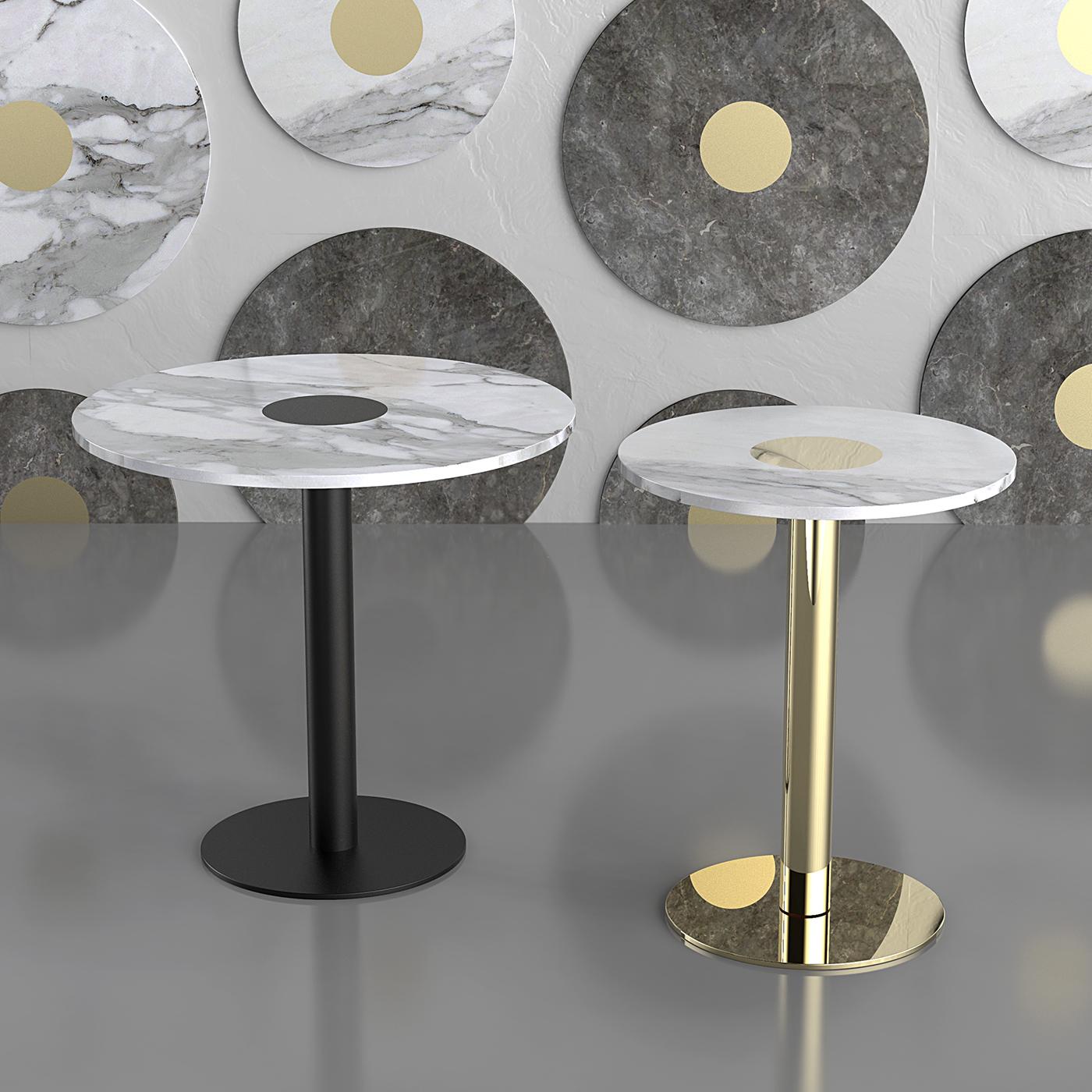 This stunning side table combines Parisian cafe vibes with a bold modern allure. Pairing a brass pedestal base with a luxurious Calacatta marble top, The Coccaro Brass Bistro Table is characterized by compact dimensions and sleek lines, making it