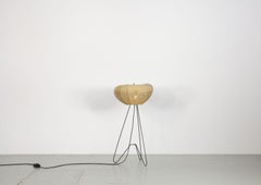 Coccon-shaped Three-legged floor lamp from the 50s.