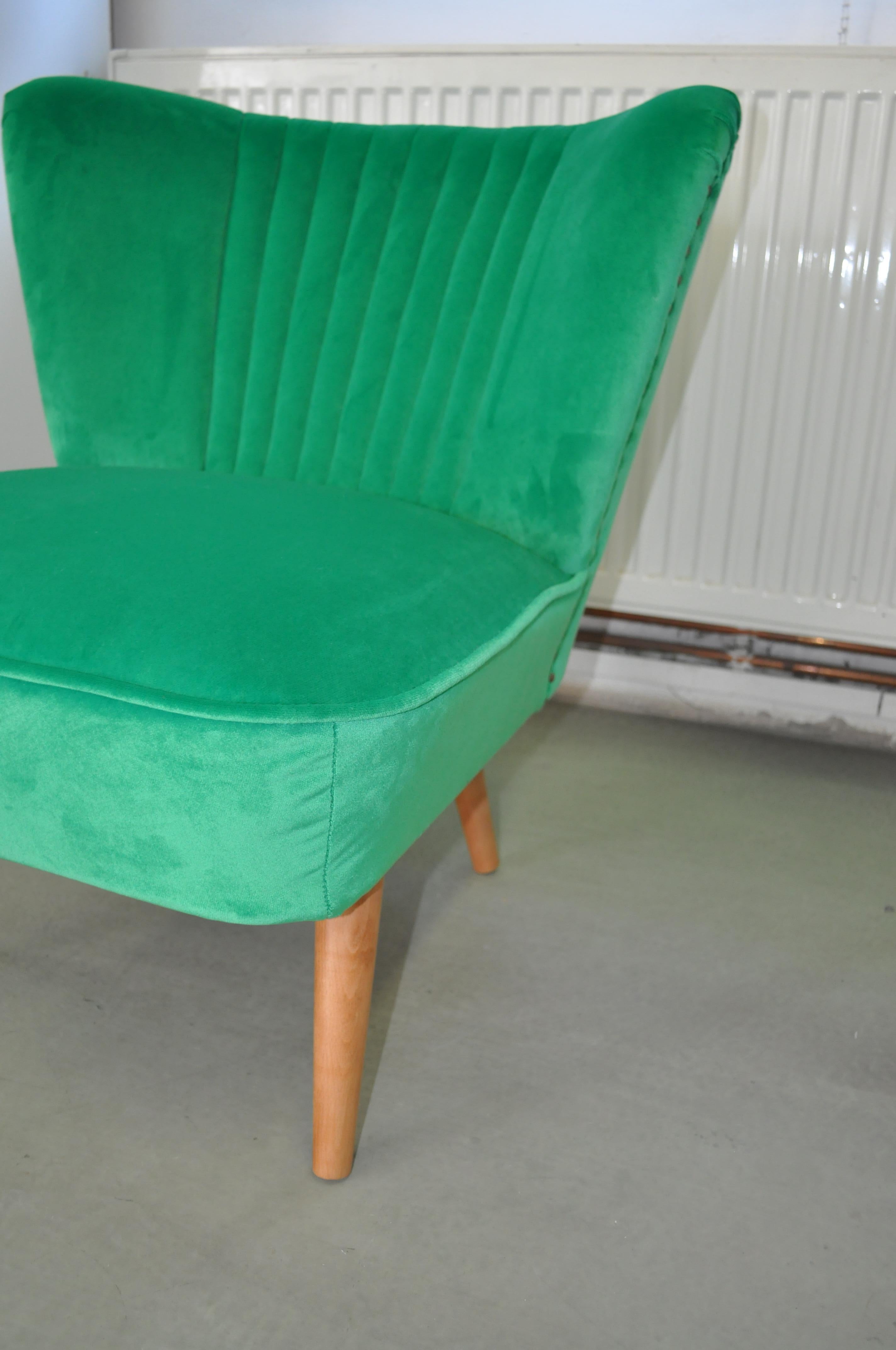 1950s shell back cocktail chair recovered with a green fabric. Very well constructed, extremely comfortable.
The chair fully re-upholstered with a green colored fabric.
This club chair was manufactured in Budapest, Hungary.