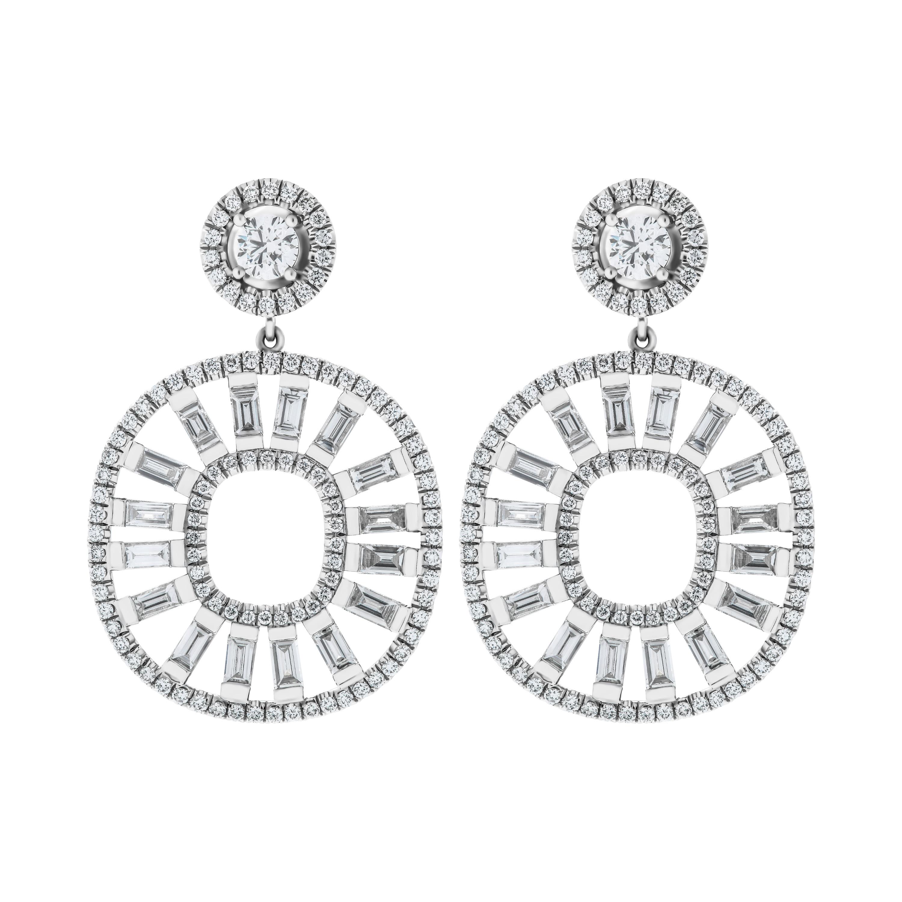 Unique and Elegant, one of a kind custom made Earrings that you won't see anywhere else!
Earring featuring 16 baguette diamonds (each earring)  totaling 3.83ct on the bottom pave wire, and 2 GIA certified round diamonds on the top: 
0.40ct G VS1