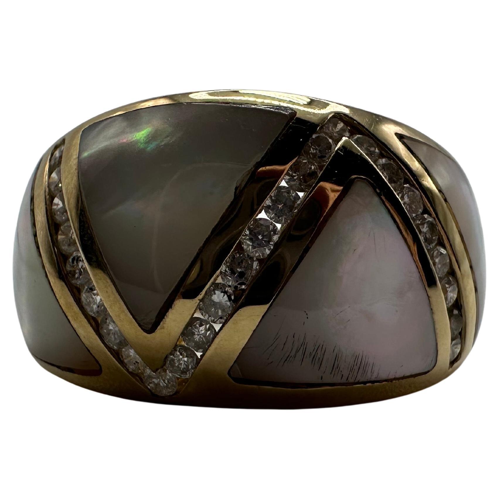 Stunning cocktail dome ring in 14KT gold with mother of pearl custom inlays and natural diamonds. Size is 7 can be re-sized free of charge! Ring is 10 grams, 0.50 carats VS-SI diamonds clarity and F-G  color.
WHAT YOU GET AT STAMPAR