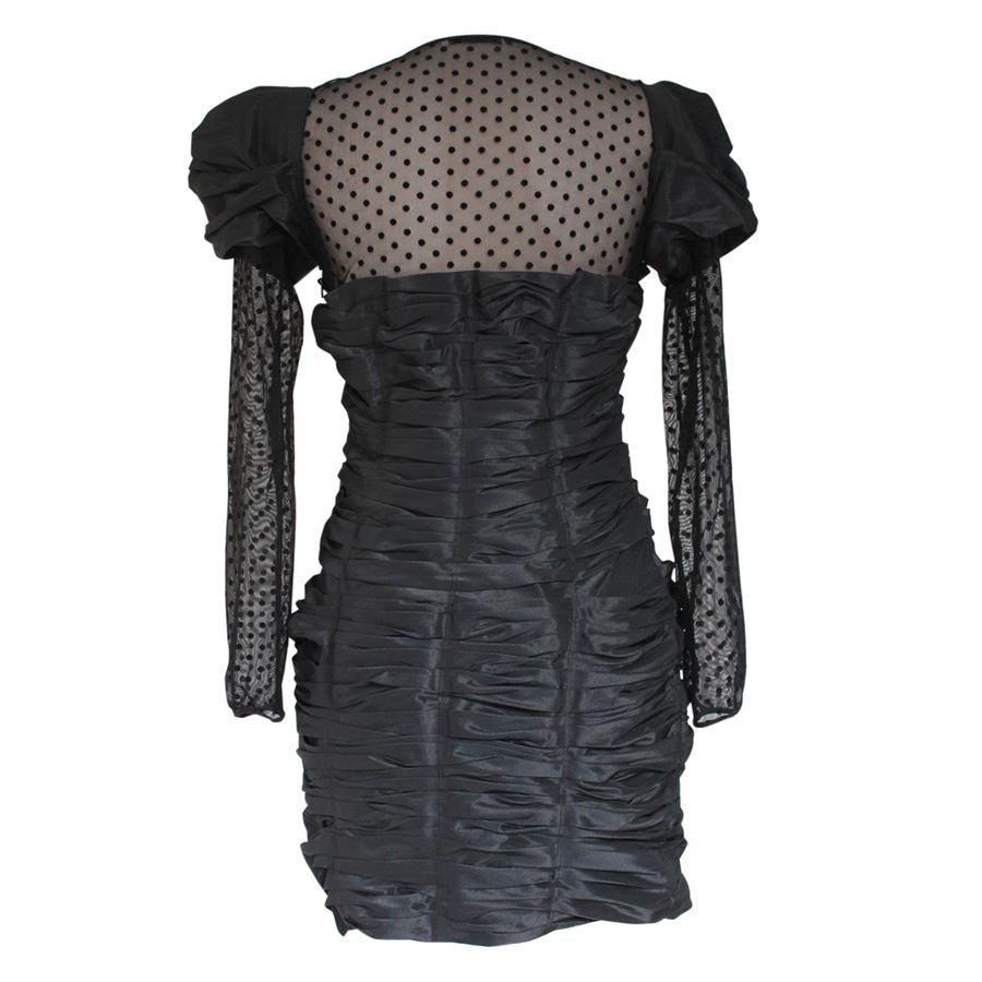 Polyester Black color Embossed on shoulders and body Voile insert on sleeves and the top Total length cm 80 (31.4 inches)
