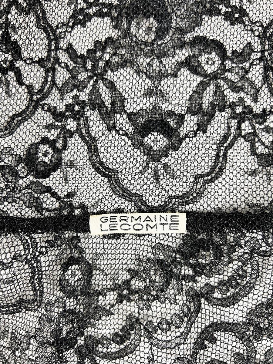 Circa 1950

France

Magnificent cocktail or dinner dress in black Calais lace, known as Chantilly lace, dating from the late 1940s and inspired by Christian Dior's New-look period in France. The dress has a frock coat cut, three-quarter length