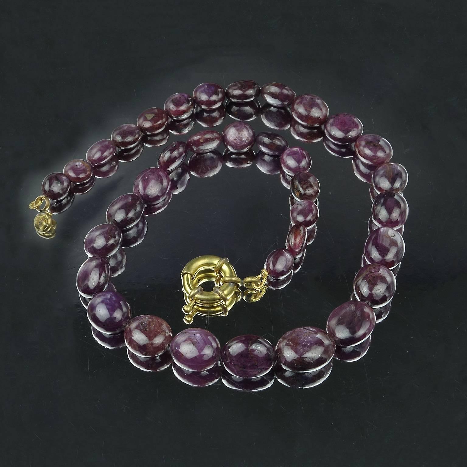 18.5 Inch, custom made necklace of graduated Rubies.  These beauties will grace your neck and love you back as much as you love them.  This unique necklace graduates from 10x8mm to 16x13mm, and the color is a deep purple-mauve. The necklace is