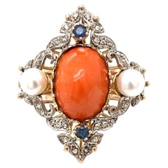 COCKTAIL RING- Coral, Saphire and Diamonds in 14kt Rose Gold.