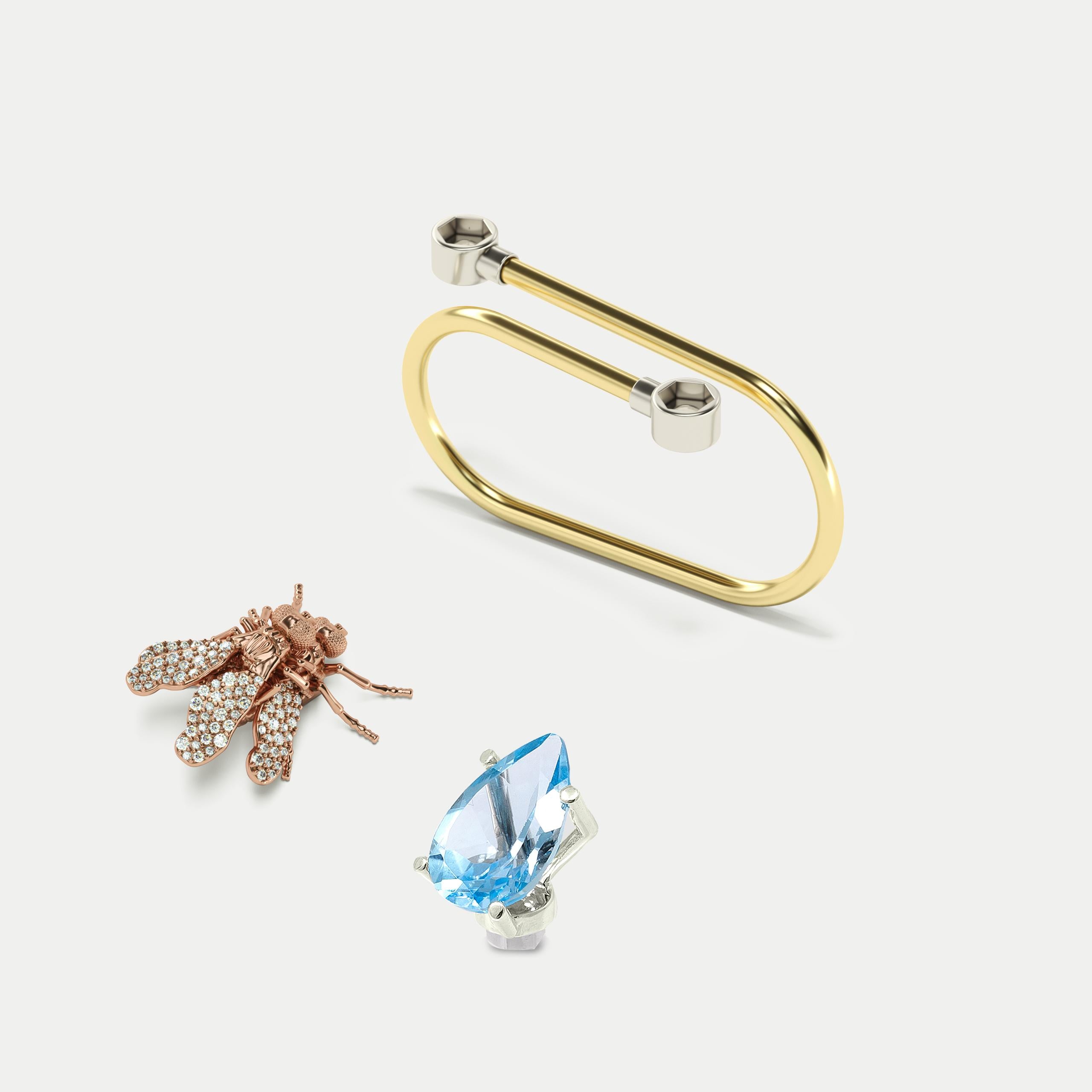 This cocktail ring for two fingers is made of 18K gold and decorated with removable Blue Sky Topaz and Flies figure in pink gold with white diamonds.
·Ring in Yellow Gold, 18K
·Flyonfly in pink gold, 18K with Full pavé in wings of White Diamonds