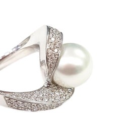 21st Century 18 Karat White Gold Pearl and Diamond Cocktail Ring with a Twist