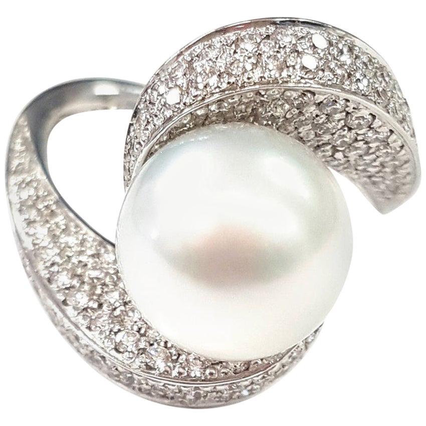 21st Century 18 Karat White Gold Pearl and Diamond Cocktail Ring with a Twist For Sale