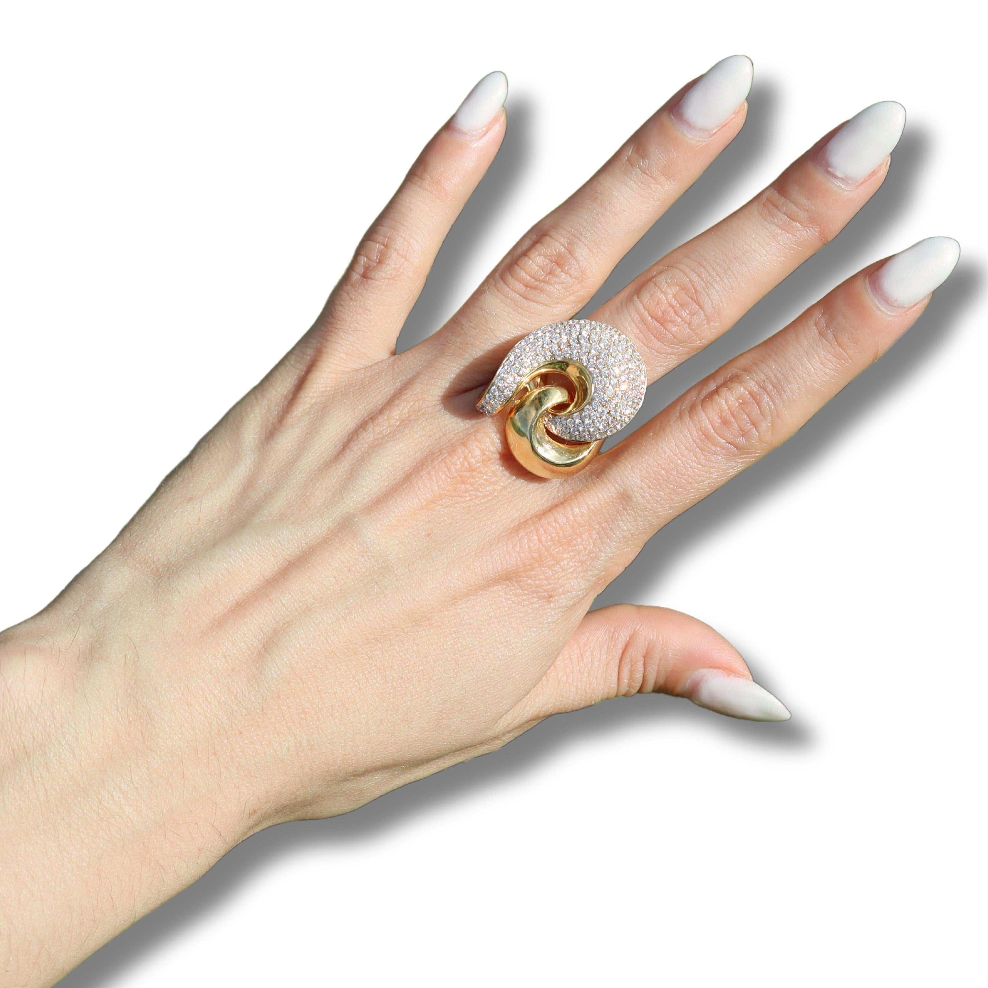 Introducing a stunning Contemporary Cocktail Ring, meticulously crafted in lustrous 18kt yellow gold. 

This exquisite piece showcases a captivating pave of 155 graduated round-cut diamonds, totaling approximately 2.18 carats. Each diamond is of VS2