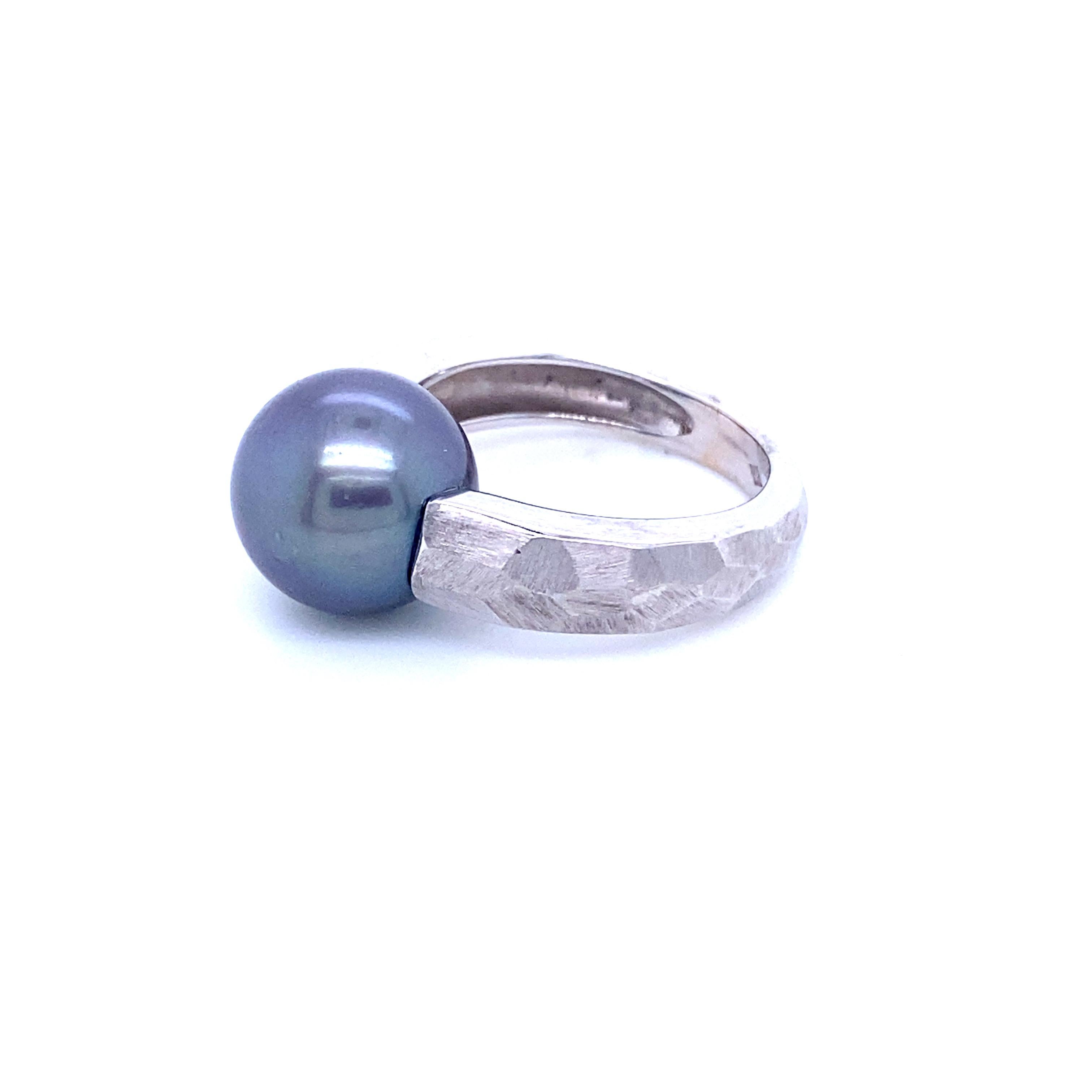 Cocktail Ring in Grey Gold and Tahiti Pearl
French Collection by Mesure et Art du Temps. 

18 Carat white gold ring topped with a Tahitian pearl measuring 11-11.5 mm. The pearl weighs 2.1 grams.
The ring weighs 6.1 grams.
From prehistory to modern