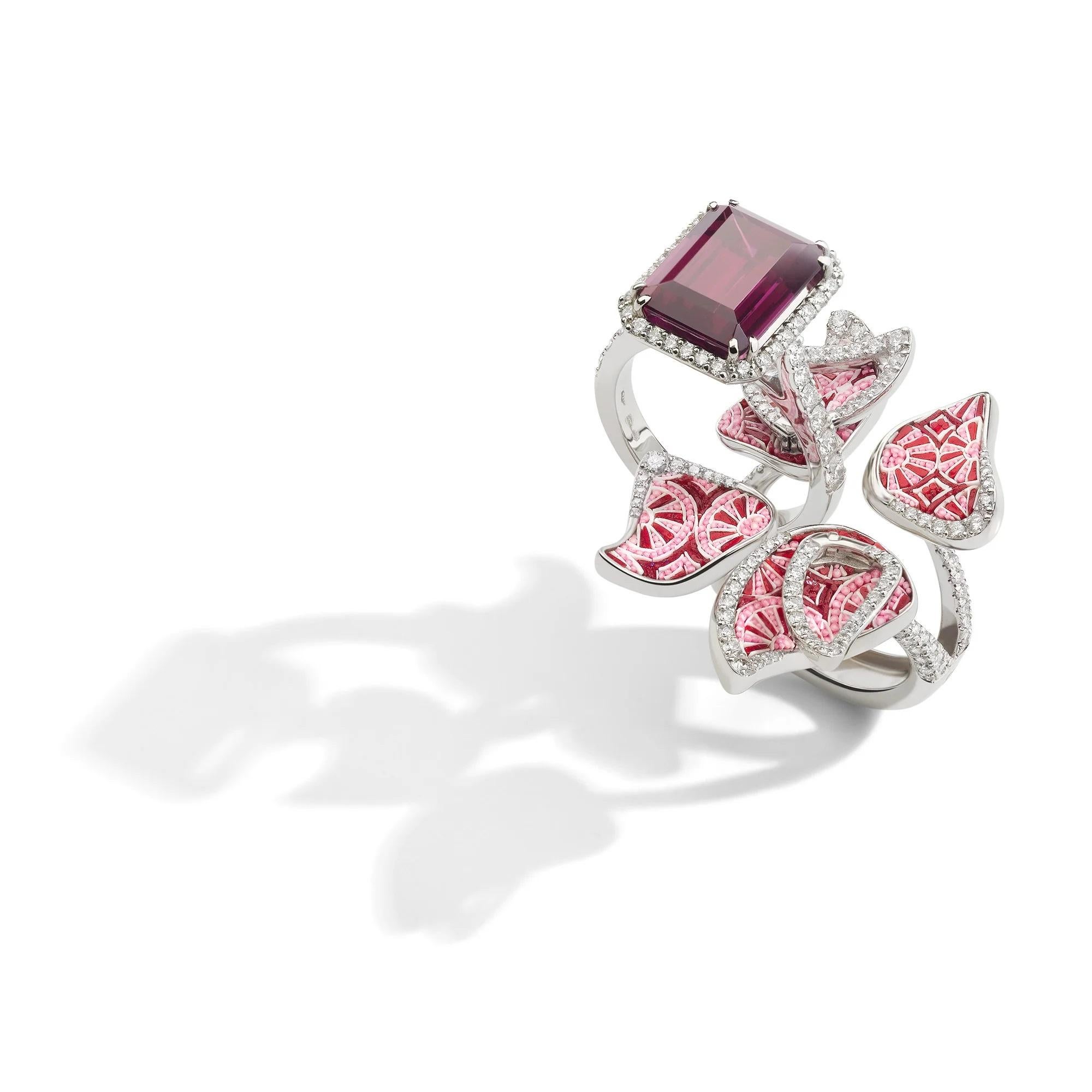 Fall in love with the Infinity Revolve ring, a masterpiece that embodies eternal beauty and elegance. Crafted with meticulous care, this enchanting ring features a vibrant mosaic pattern in captivating shades of red and pink mosaics.
At it’s center