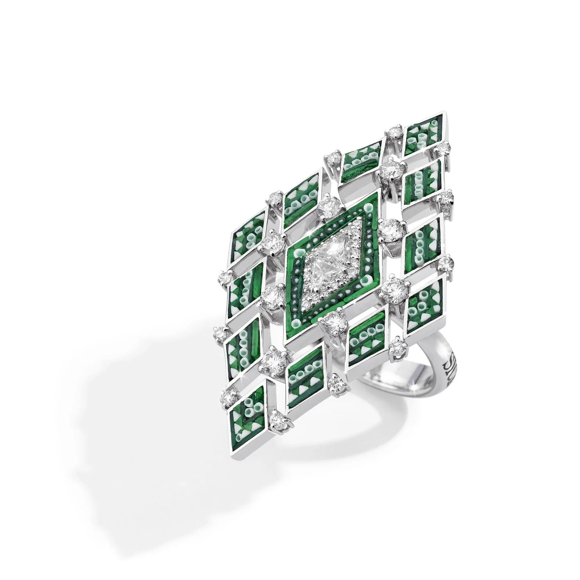 Experience the epitome of refined elegance with our exquisite Losange Emeraude ring. 
Crafted from pristine white gold, adorned with intricate micromosaic, scintillating diamonds, and vibrant emeralds, it exudes a timeless allure. 
The harmonious