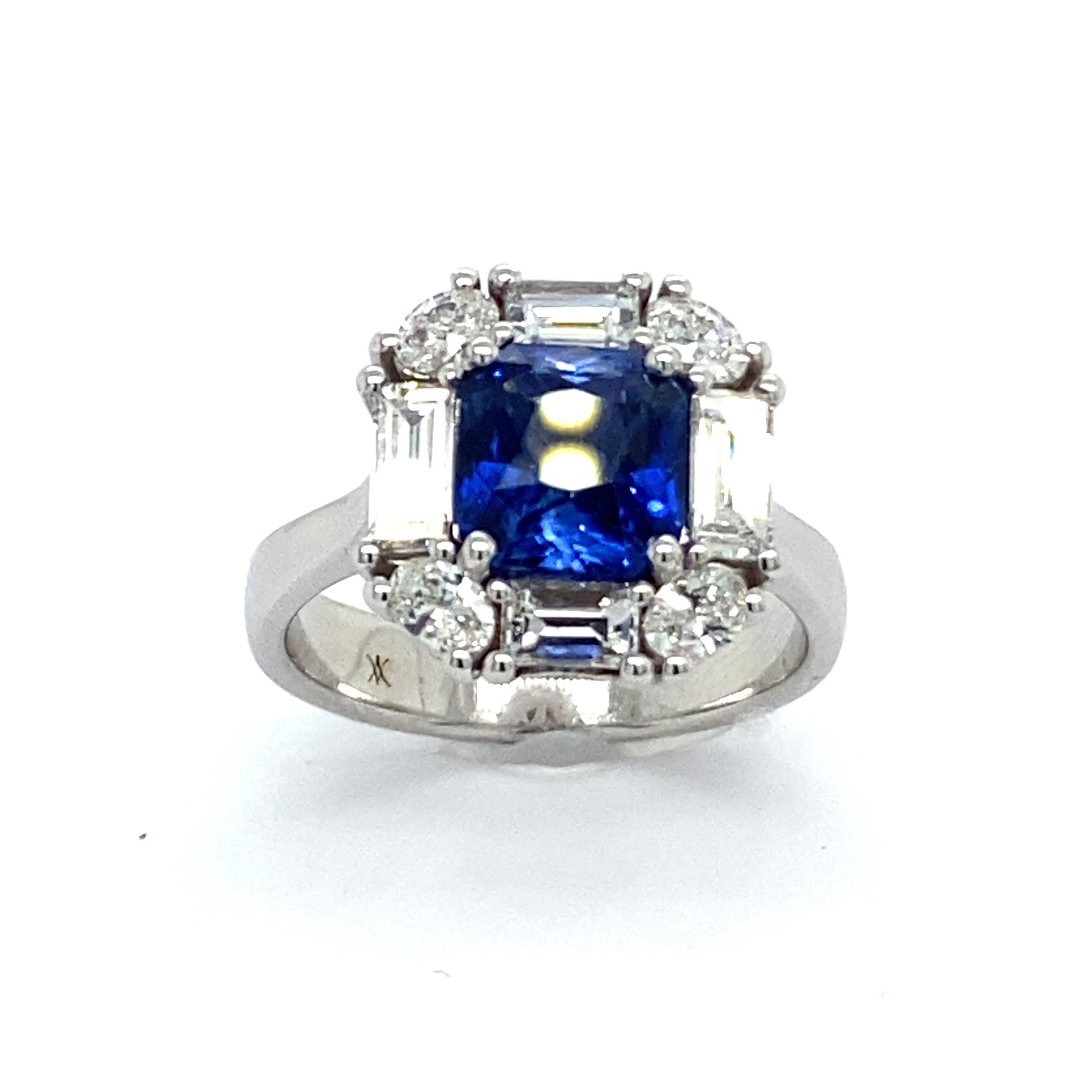 Discover this magnificent cocktail ring from the French collection of Mesure et Art du Temps, a truly exceptional piece. The ring is set with a dazzlingly beautiful natural blue sapphire, weighing 2.28 carats. The radiant shape of the sapphire adds