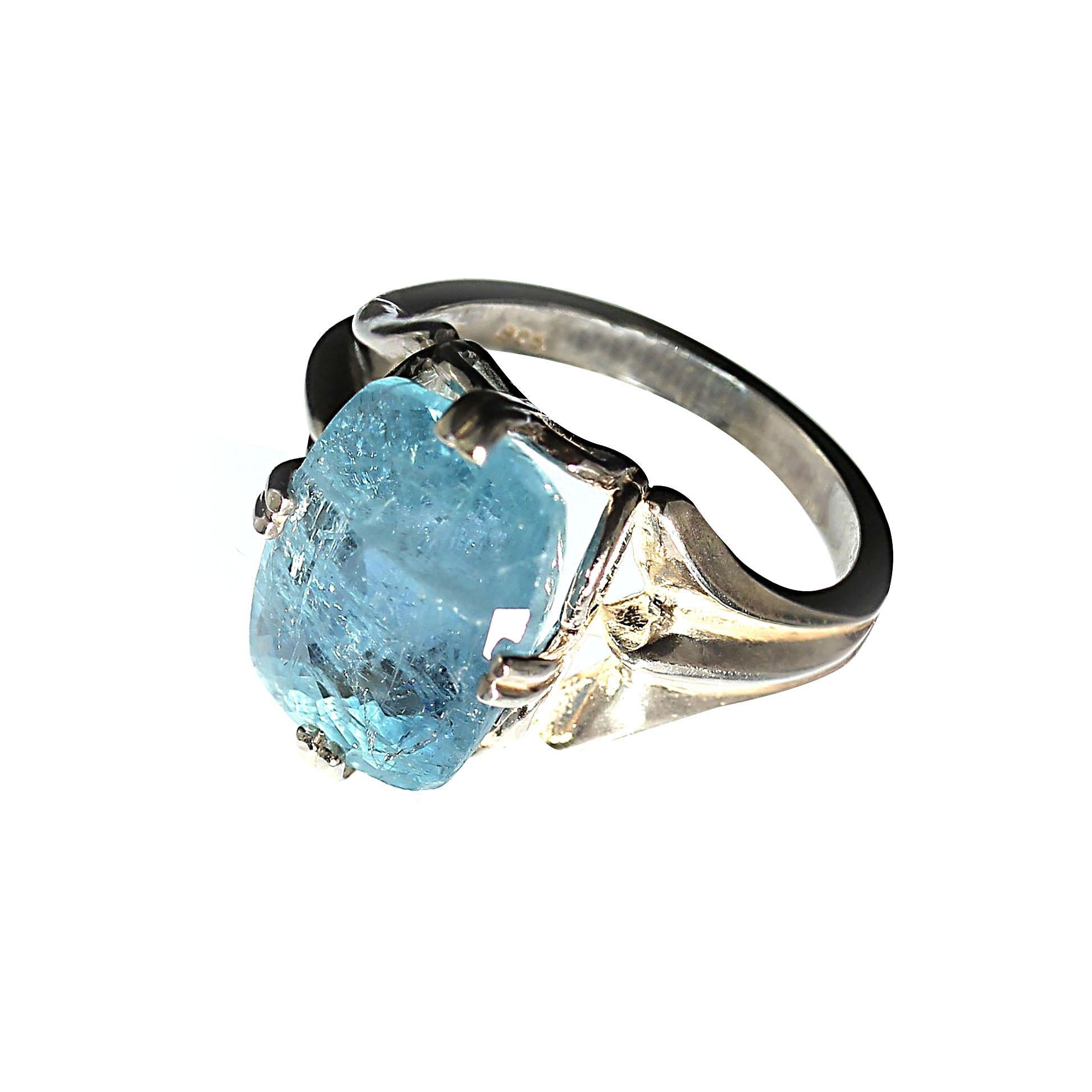 Custom made, Blue Aquamarine in a lovely Cushion set in Sterling Silver ring with detail and elegance. The four prongs are set on the sides and not the corners of the gemstone.  This unique Aquamarine is a beautiful deep real Aquamarine blue and