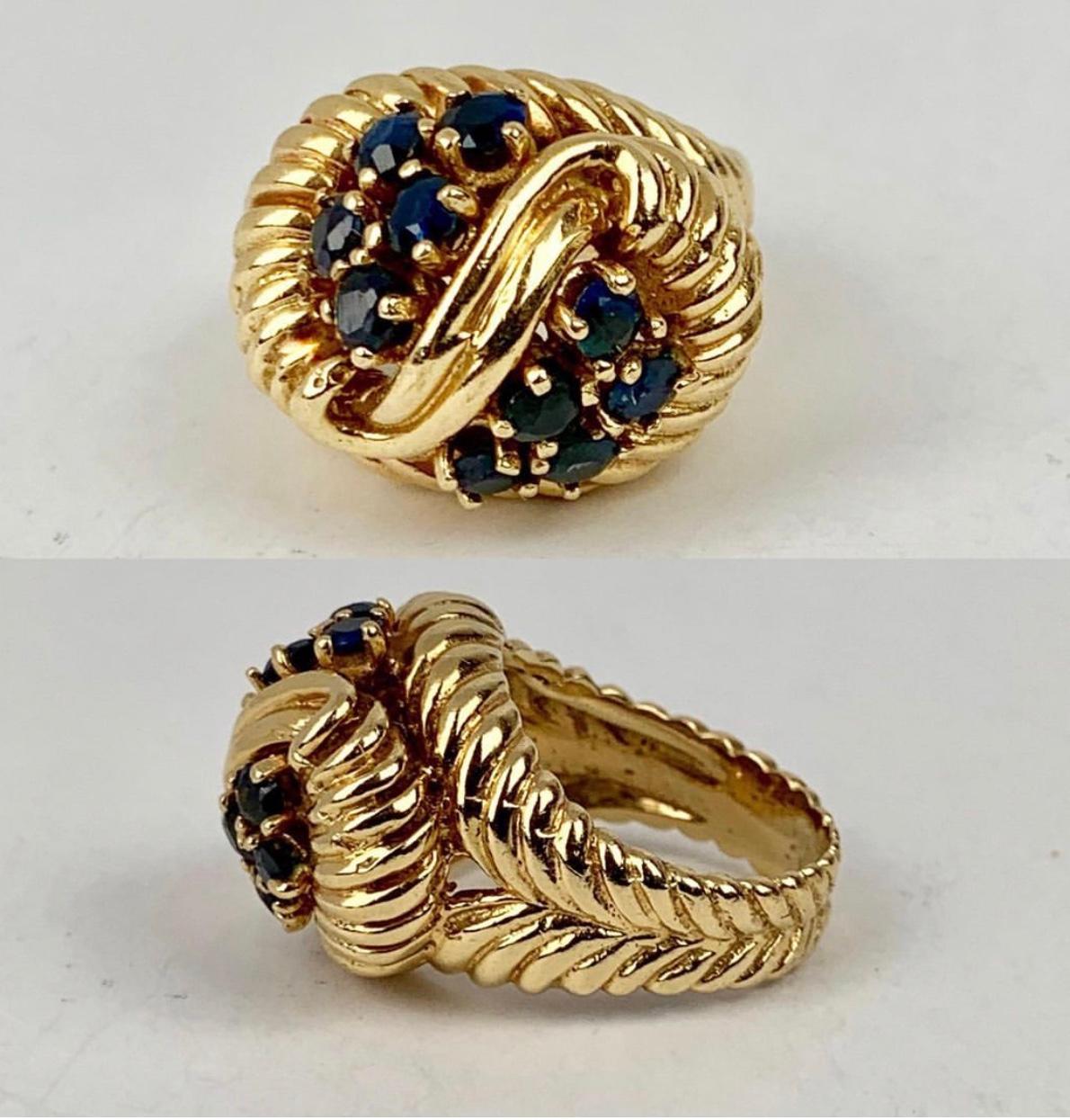 Shrimp style 14k yellow gold ring with 10 round faceted sapphires.  From the 1960's in all original and fine condition.
What is known as 