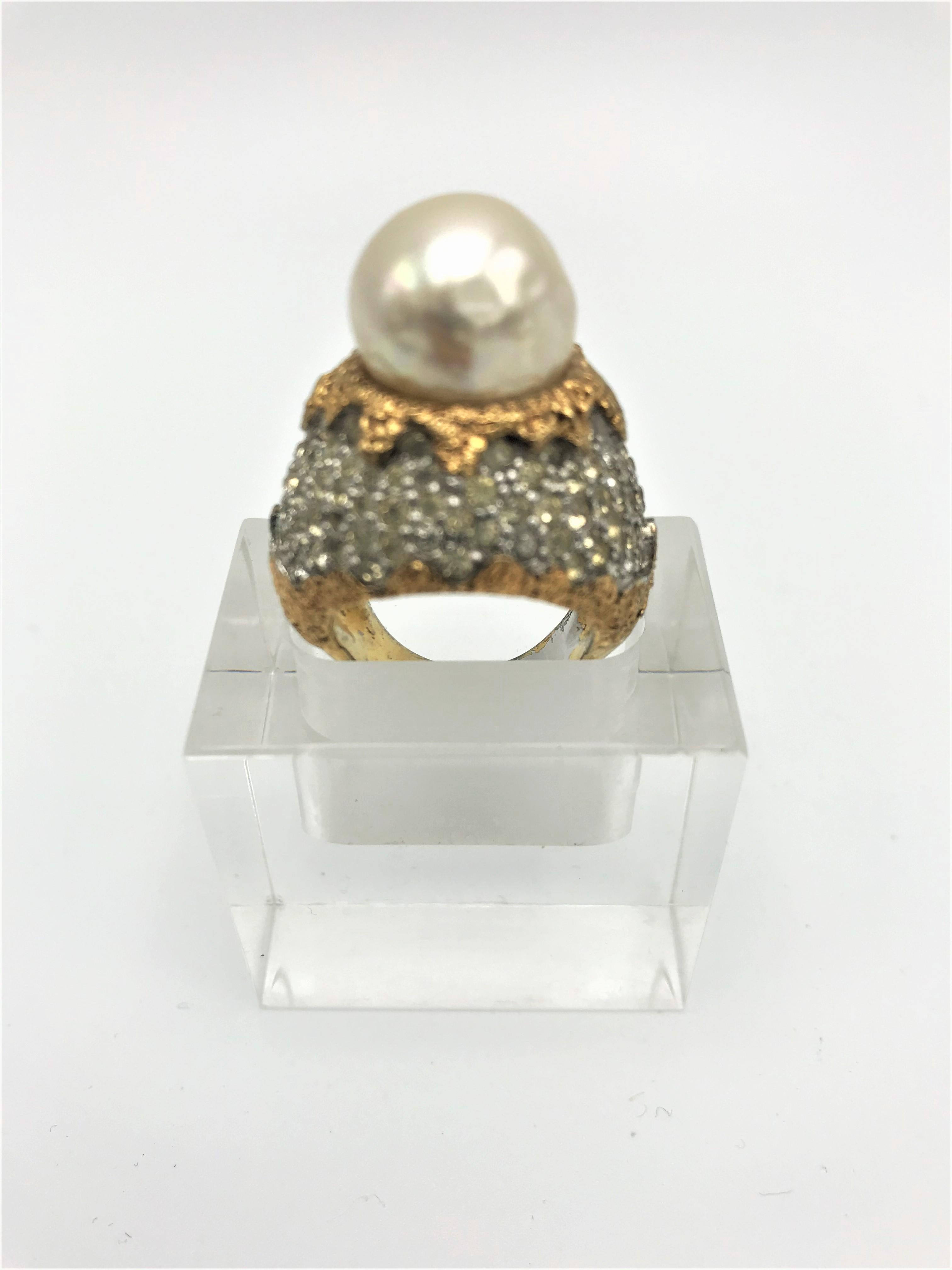 Vintage cocktail ring with large false pearl on top then set with many small rhinestones (silver part) signed JOMAS USA gold-plated. This ring coms from this collection by Ann Miller! 
Measurement: Ring size 56, faux pearl 1,5 cm, Dome - Ring height