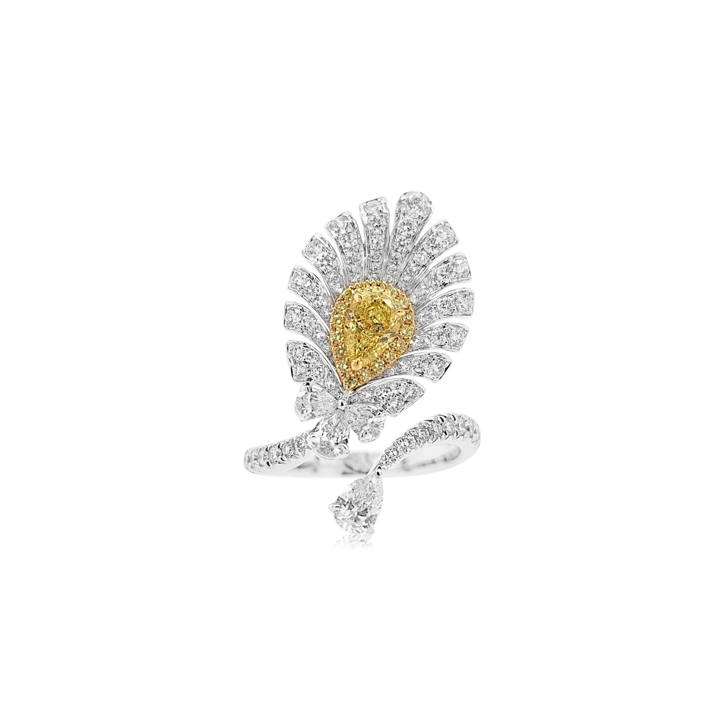 A one-of-a-kind Cocktail ring with a feather-like appearance dazzling with mesmerizing Yellow diamonds and white diamonds

-	Centre Diamond, GIA Certified Pear-shape Yellow Diamond 0.50 carat 
-	Round Brilliant Cut Yellow Diamonds total 0.09
