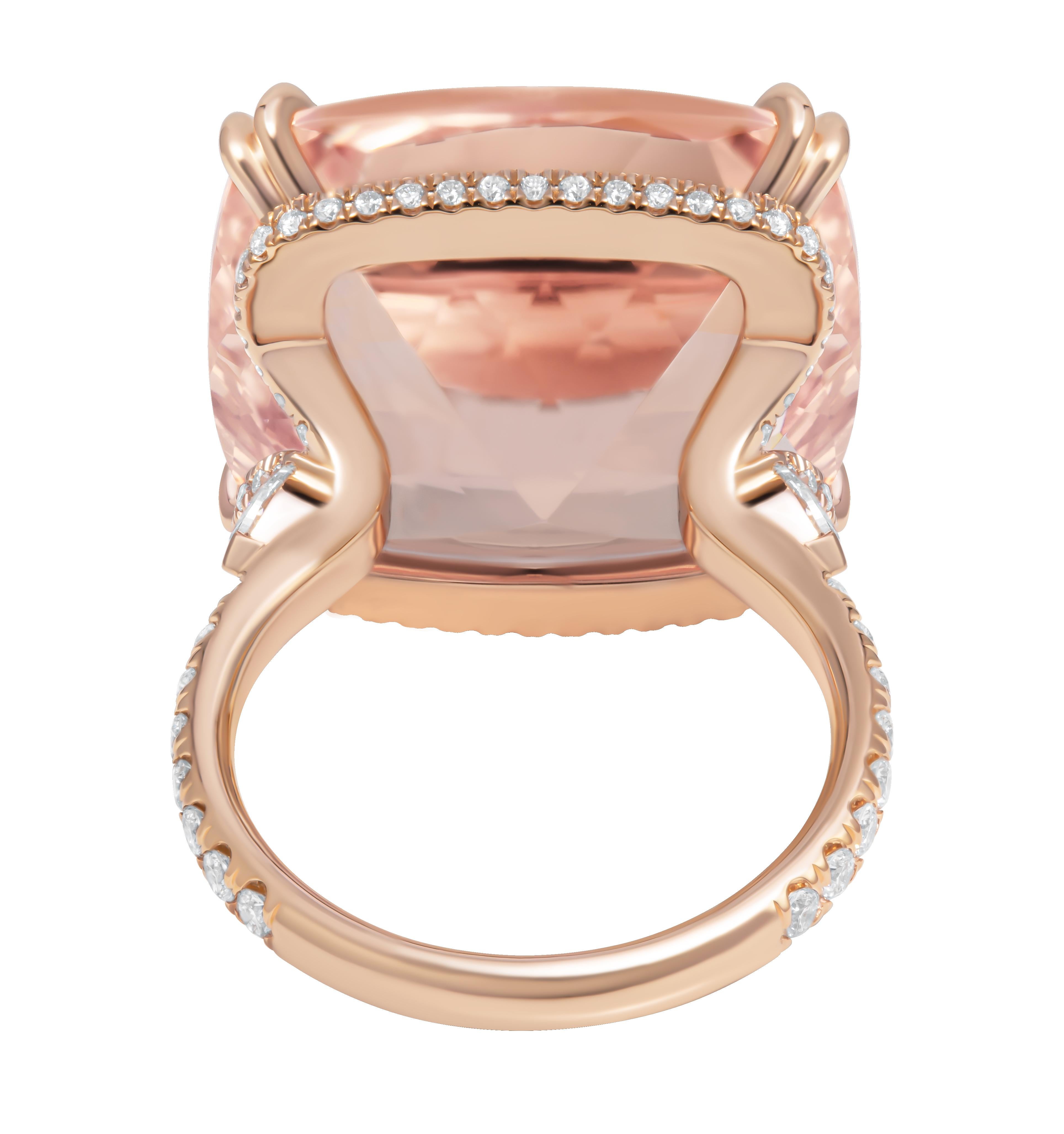 Cocktail Ring with Pink Morganite
Made in 14K rose gold ring with plunge halo and pear shape side stones with split claw prong, diamond shank

Center Stone: 24.81CT Morganite 
Side Stone Per Shape totaling 0.24ct
Pave totaling: 0.57ct

Size 7
