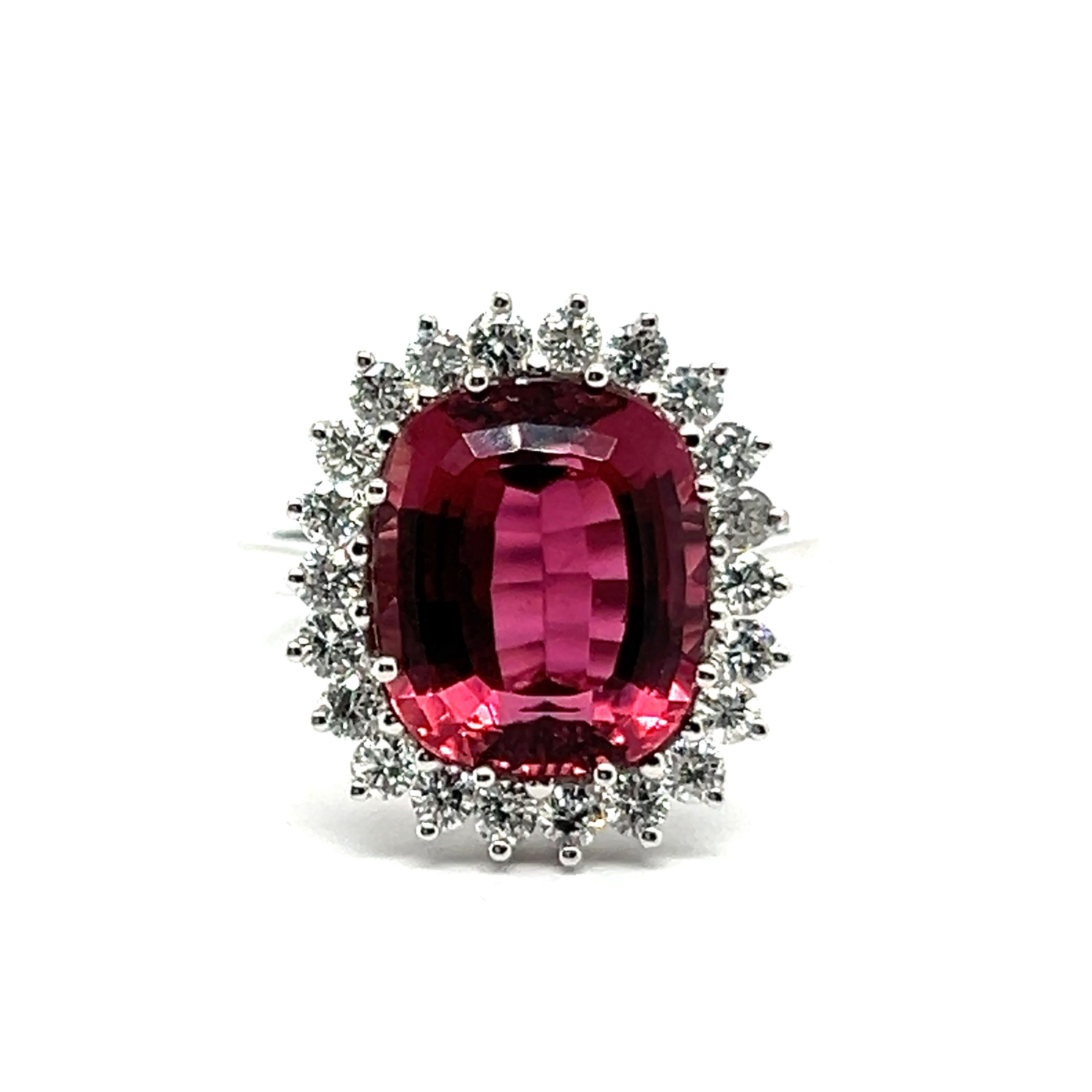 Presenting a classic tourmaline and diamond ring set in 18 Karat white gold. The main character of this piece is a 6.10-carat raspberry-pink tourmaline, delicately framed by brilliant-cut diamonds totaling 0.66 carats in G-H color and VS